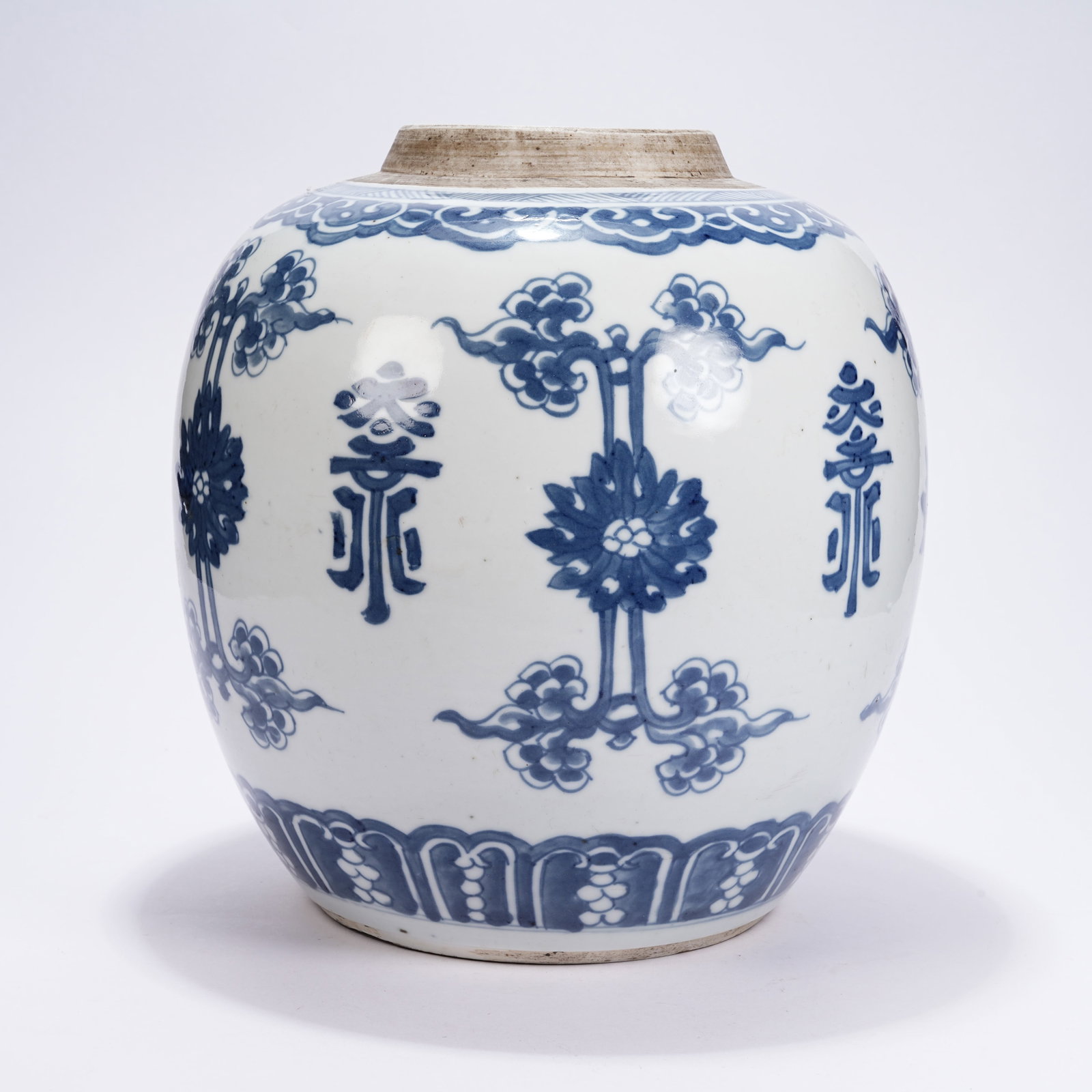 A BLUE AND WHITE JAR WITH FLORAL PATTERNS (1 of 9)