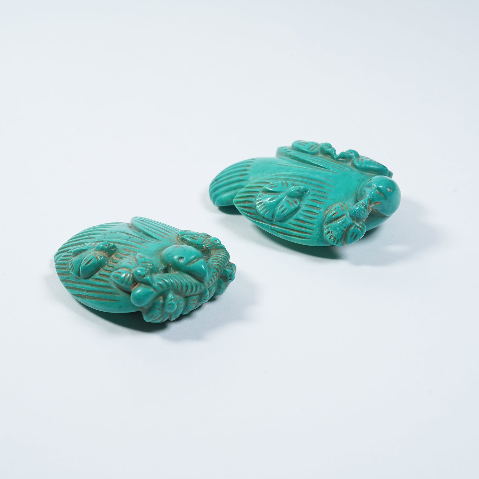 A SET OF TURQUOISE SWALLOW ORNAMENTS: Set of Turquoise Swallow Ornaments