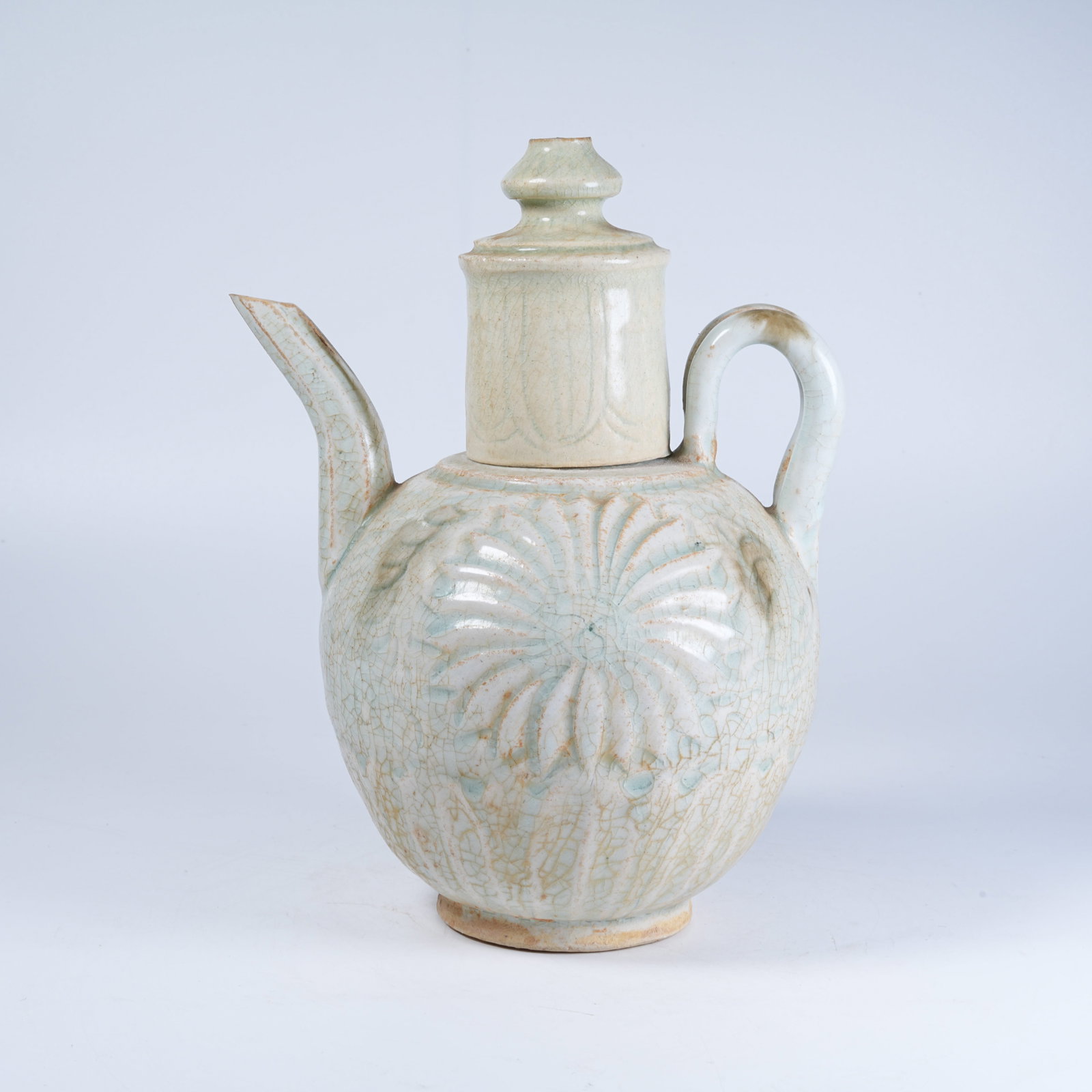 A YUE KILN EWER WITH CARVED MOTIFS: Yue Kiln Ewer with Carved Motifs