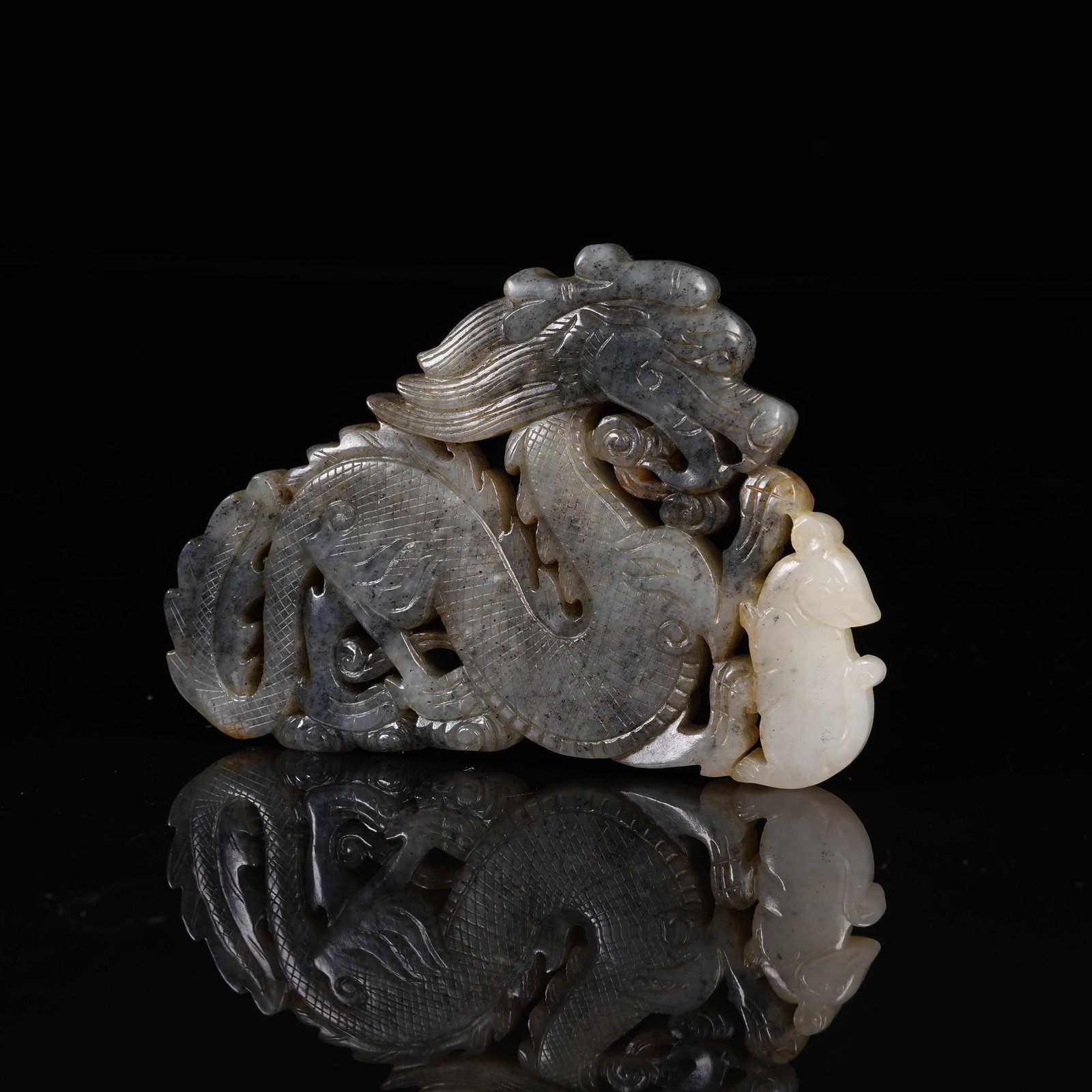 A HETIAN JADE EXQUISITELY CARVED DRAGON PENDANT: Hetian Jade Exquisitely Carved Dragon Pendant