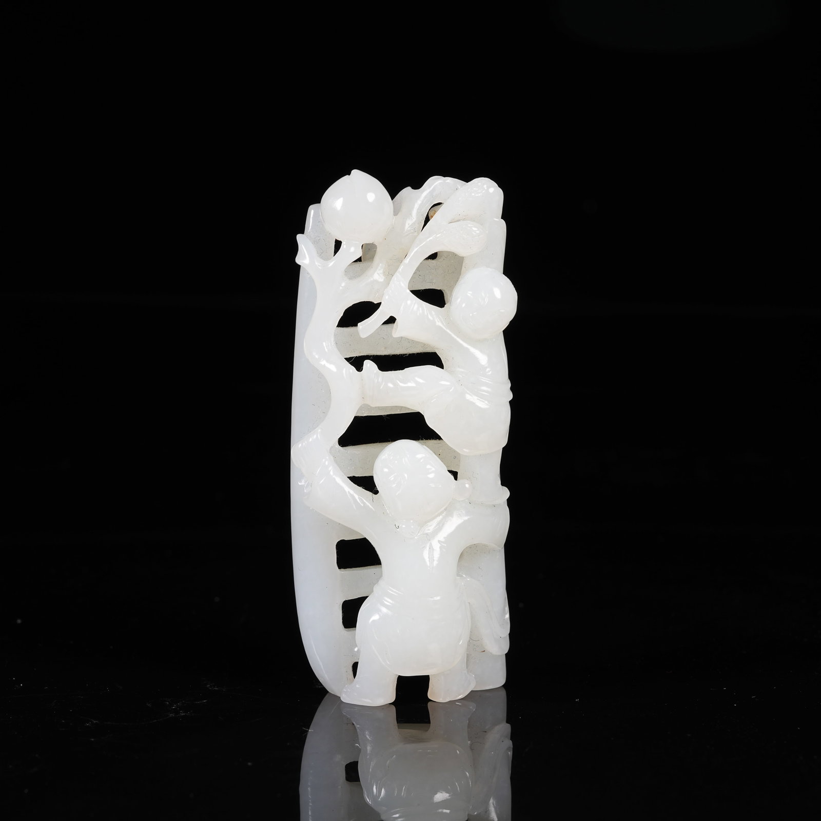 A HETIAN JADE BRUSH REST CARVED WITH BOY PICKING PEACHES (1 of 9)