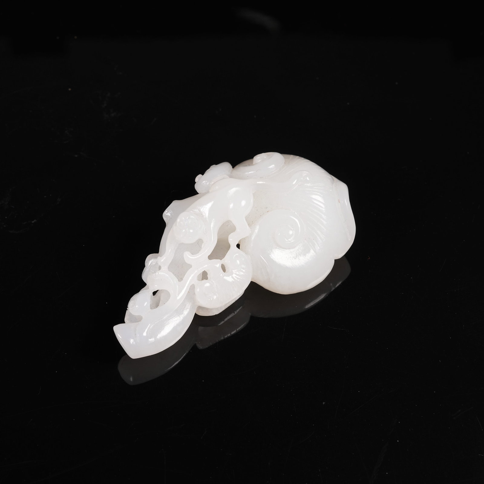 A HETIAN JADE PENDANT WITH MONKEY PRESENTING LONGEVITY MOTIF (1 of 8)