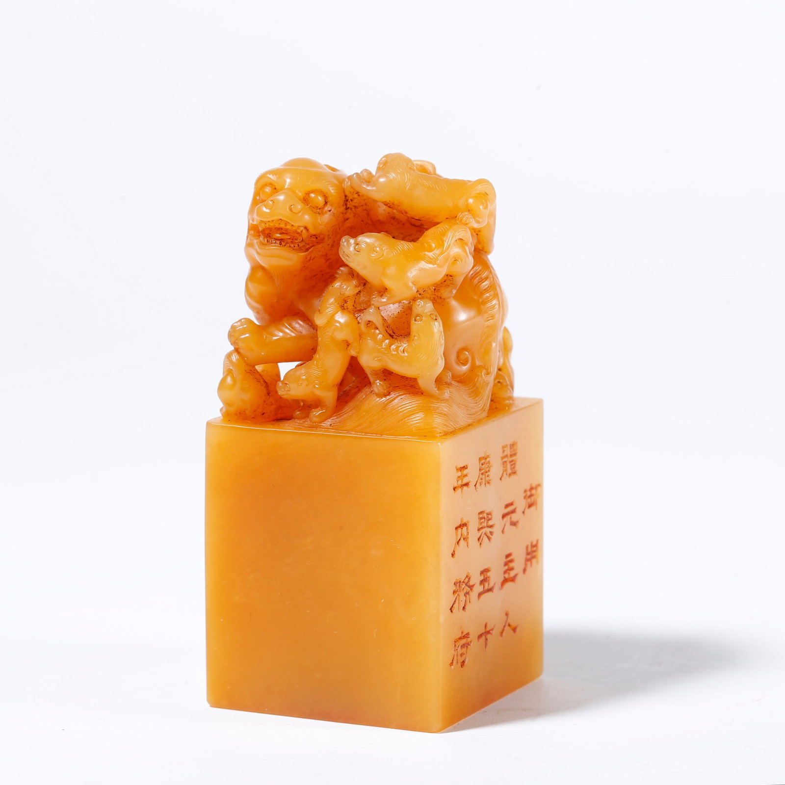 A SHOUSHAN TIANHUANG STONE SEAL WITH LION AND CUB KNOB: Shoushan Tianhuang Stone Seal with Lion and Cub Knob