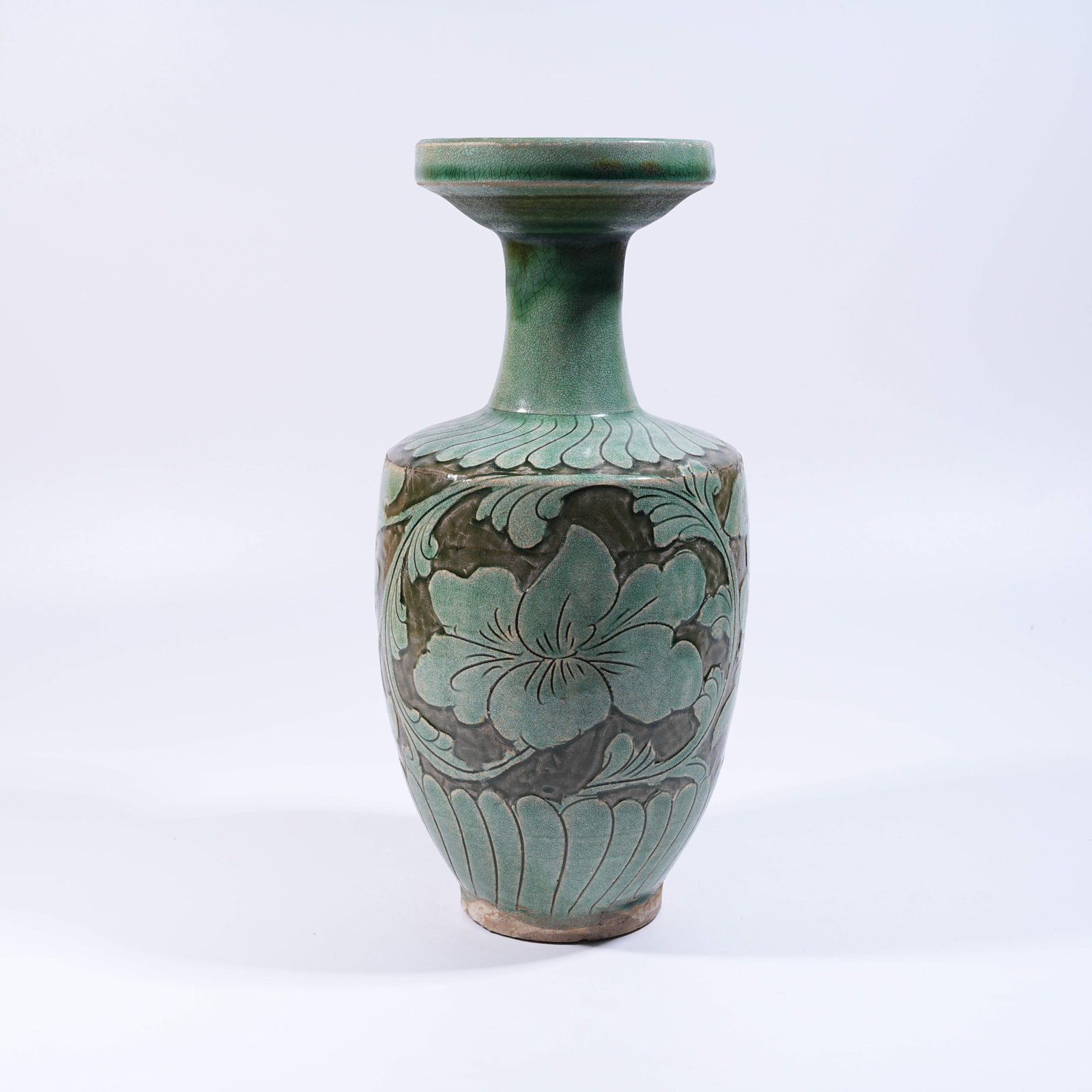 A CIZHOU KILN GREEN-GLAZED INCISED BOTTLE WITH FLARED MOUTH: Cizhou Kiln Green-Glazed Incised Bottle with Flared Mouth