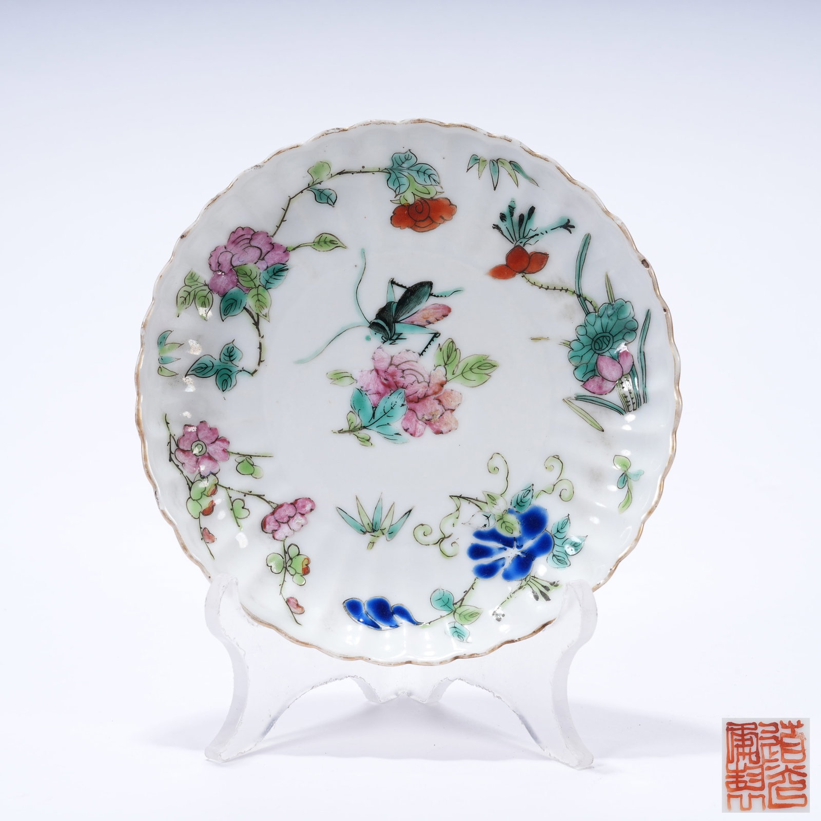 A FAMILLE ROSE FLOWER-SHAPED PLATE WITH FLOWER AND INSECT PATTERNS (1 of 9)