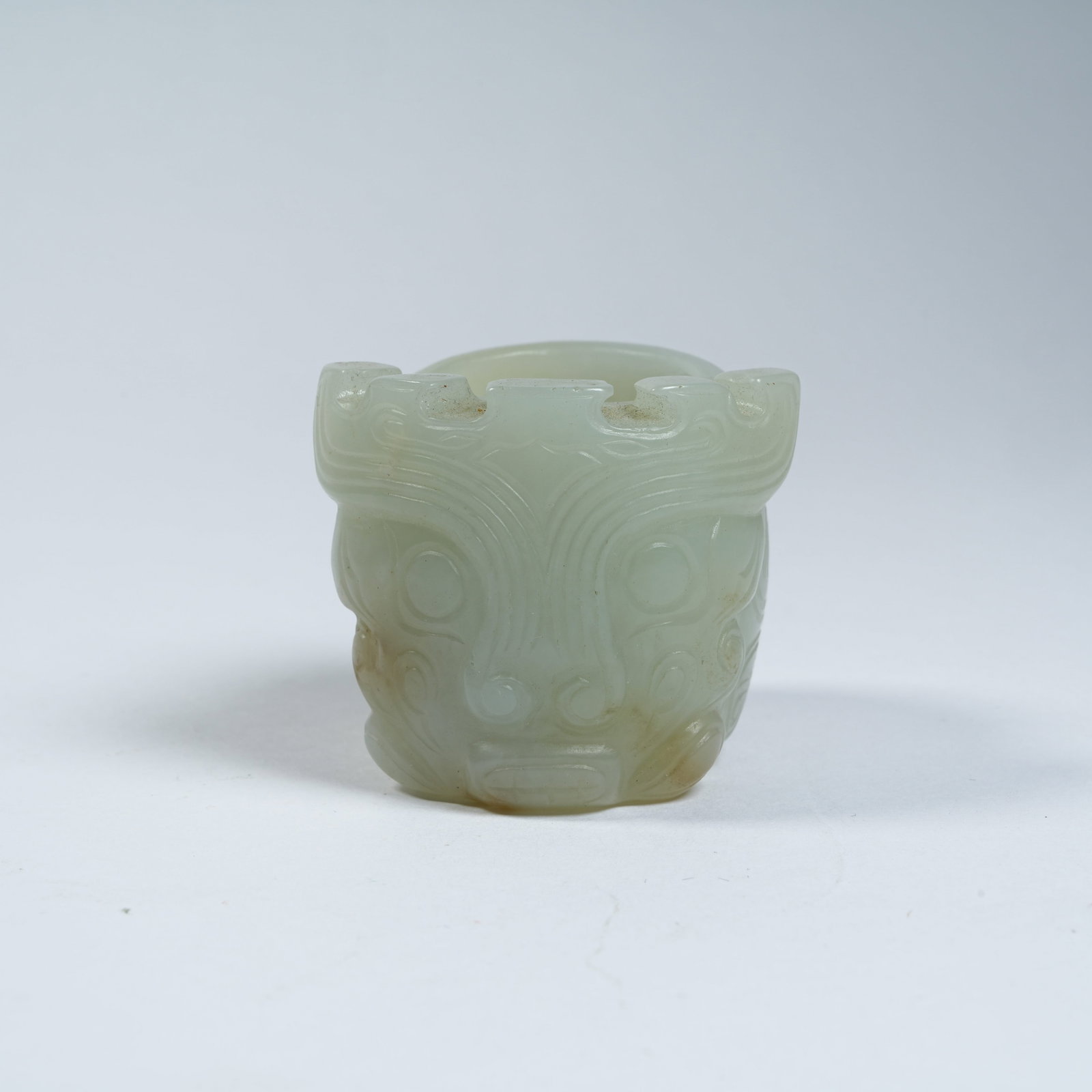 A ANCIENT JADE THUMB RING WITH DEITY MASK PATTERNS: Ancient Jade Thumb Ring with Deity Mask Patterns