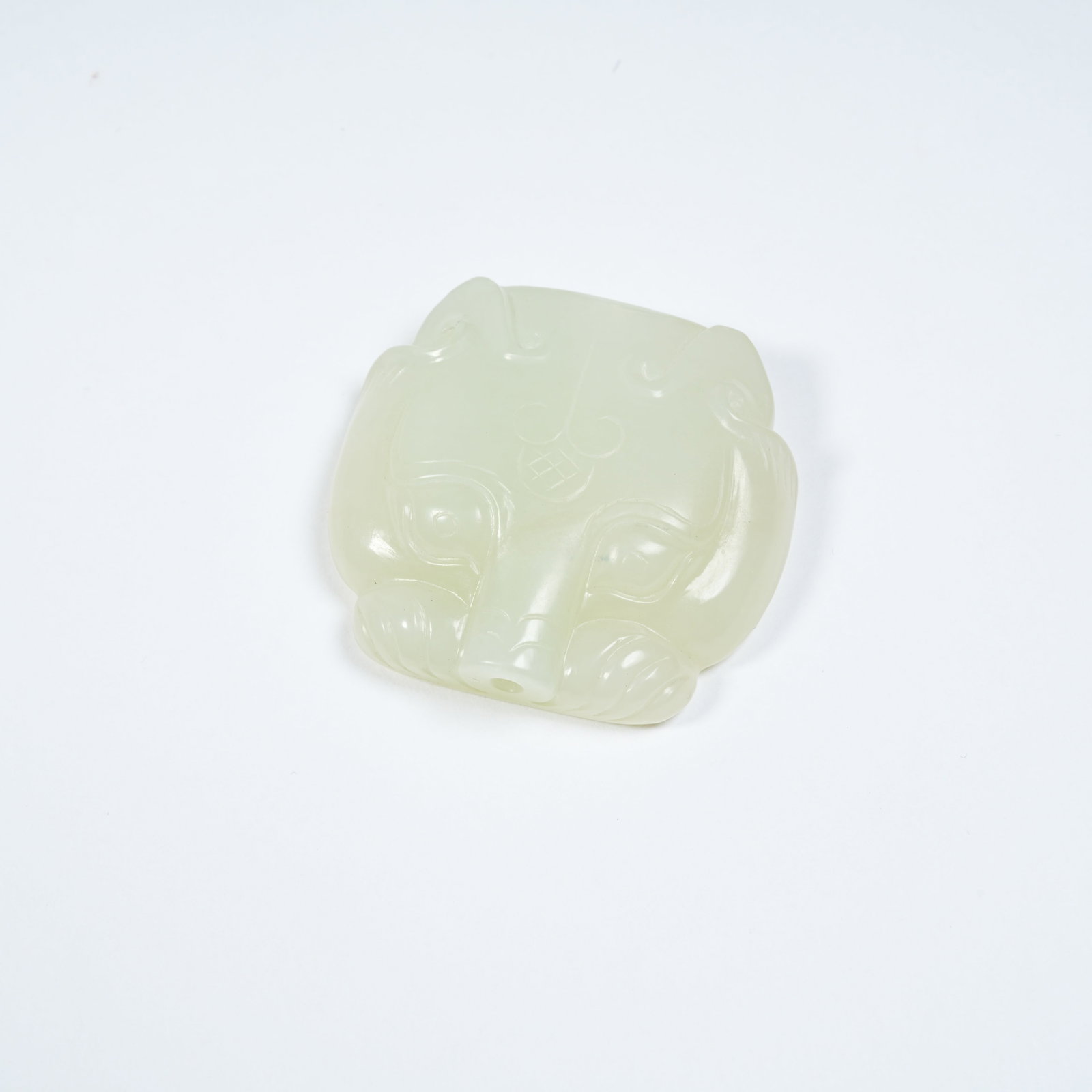A HETIAN JADE BEAST PENDANT: Hetian Jade Beast Pendant