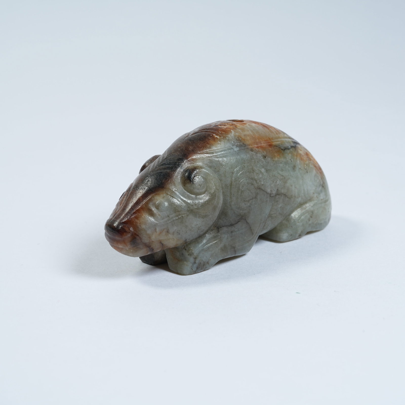 A ANCIENT JADE RECUMBENT BEAST PENDANT: Ancient Jade Recumbent Beast Pendant