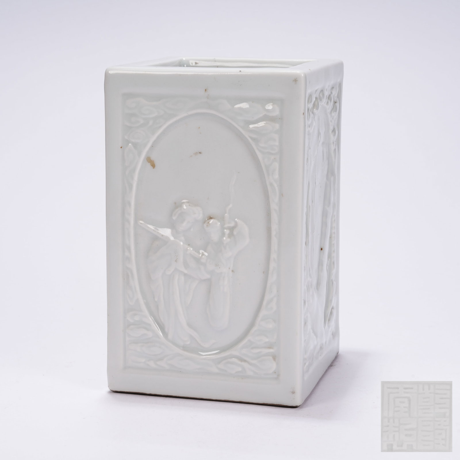 A SQUARE WHITE PORCELAIN BRUSH POT WITH APPLIED FIGURE STORY RELIEFS (1 of 9)