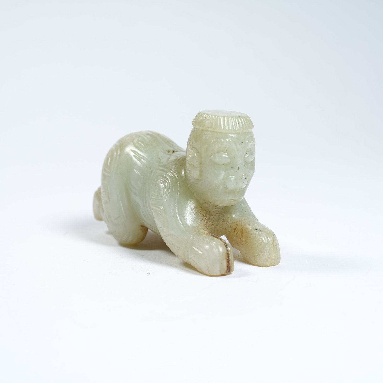 A ANCIENT JADE RECUMBENT FIGURE PENDANT (1 of 8)