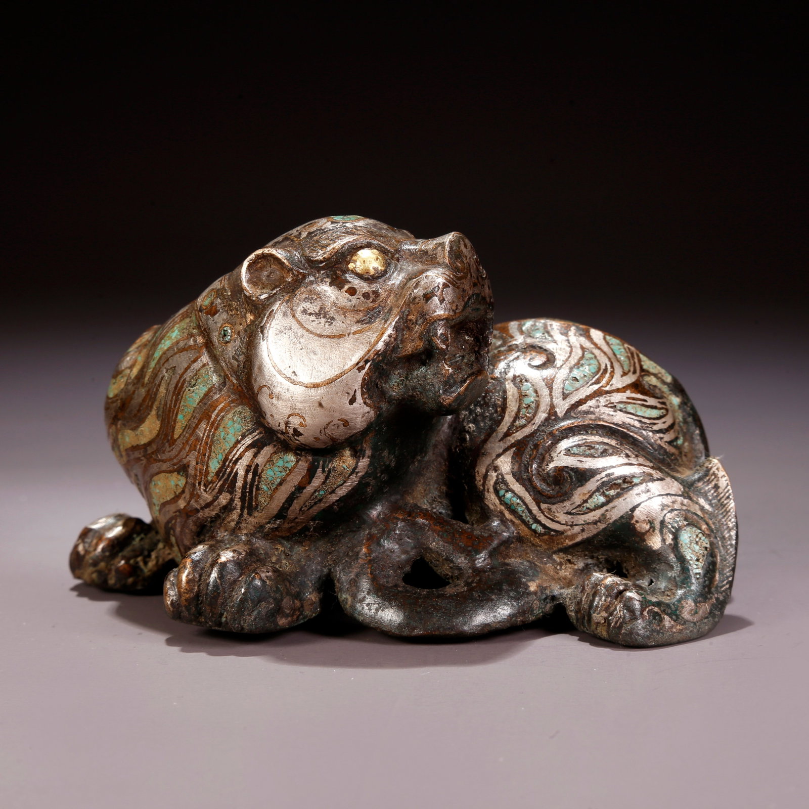 A SILVER-INLAID BRONZE TIGER FIGURINE: Silver-Inlaid Bronze Tiger Figurine