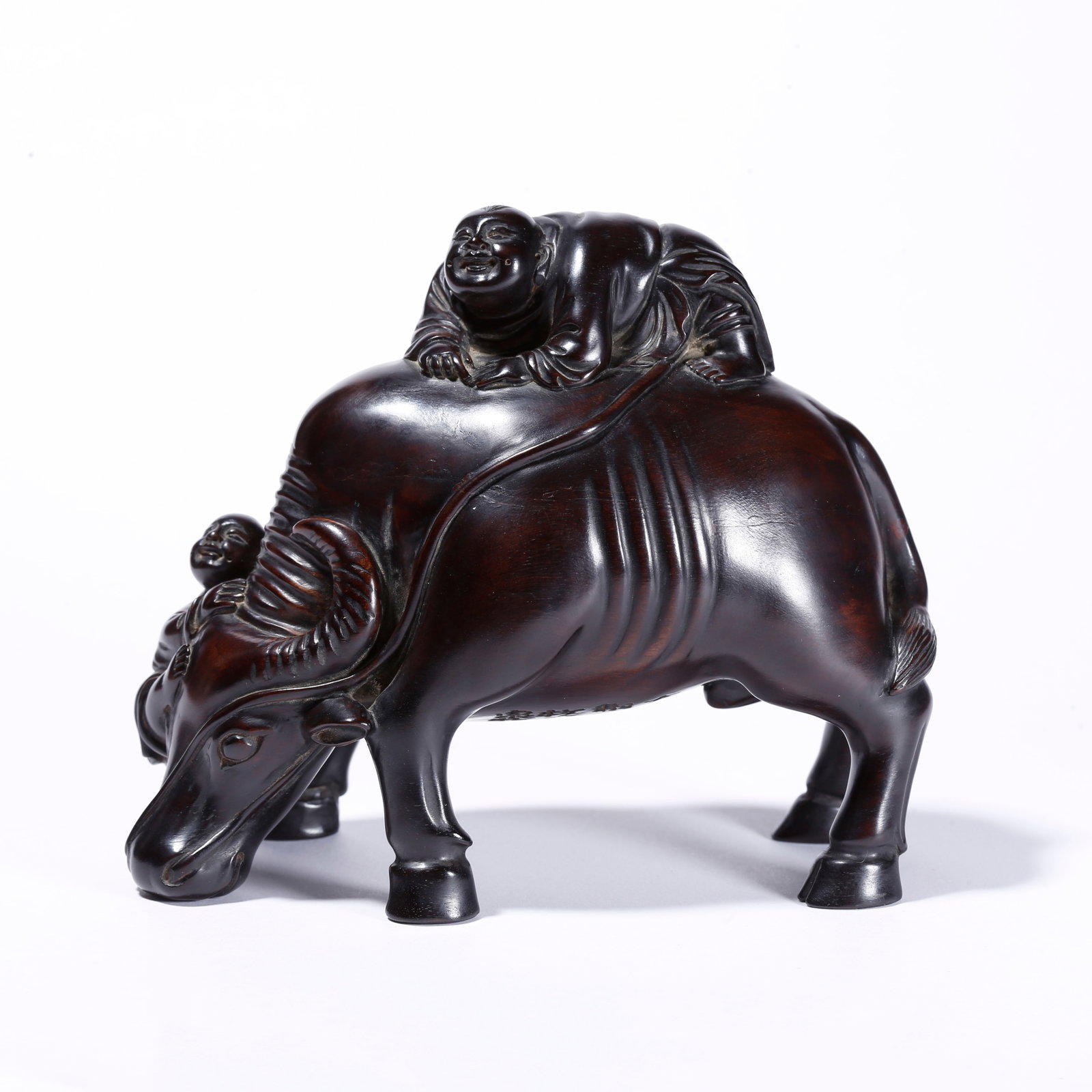 A RED SANDALWOOD BOY HERDING OX ORNAMENT (1 of 9)
