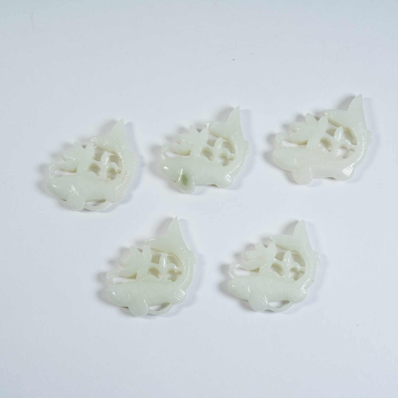 A SET OF HETIAN JADE FISH ORNAMENTS (1 of 7)