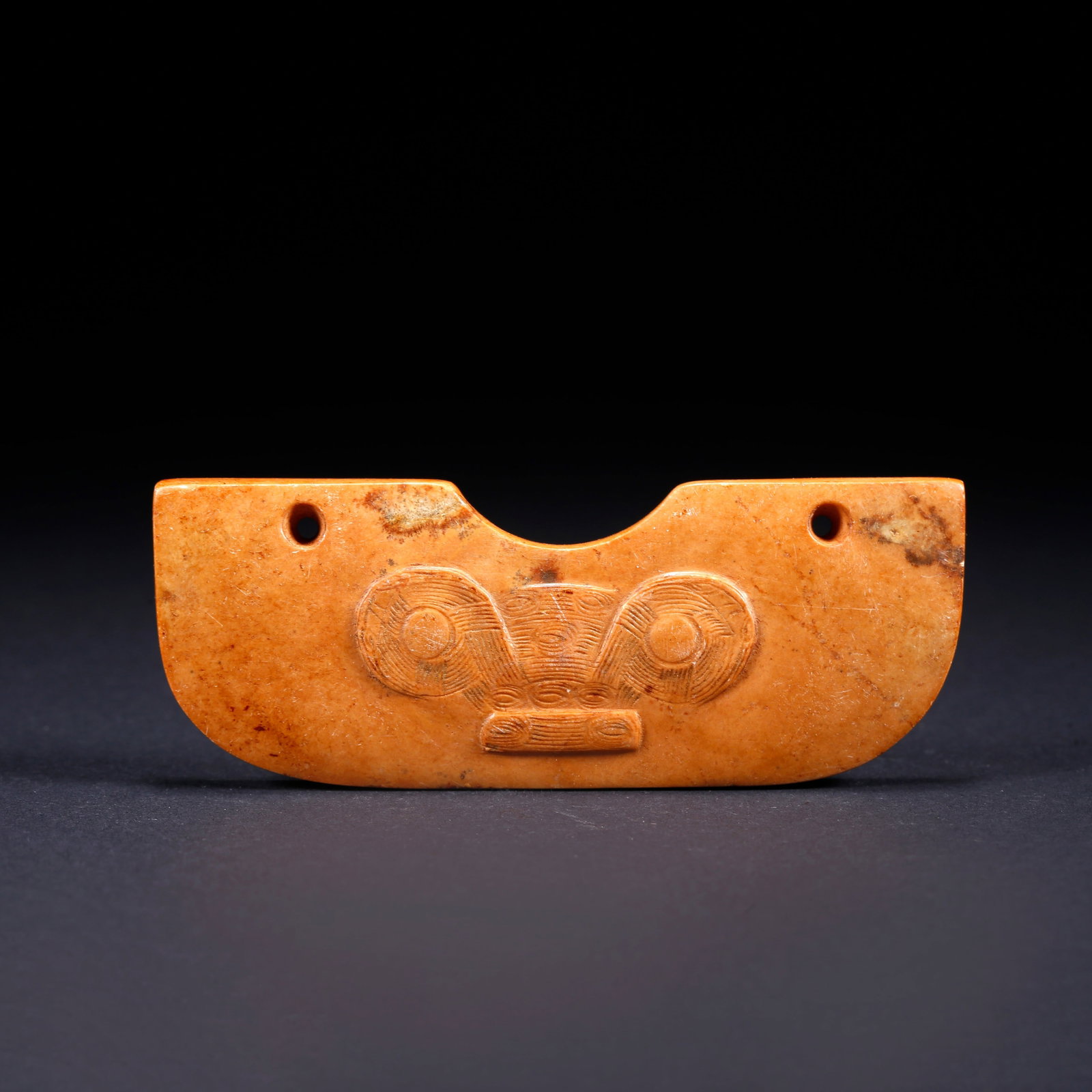 A TAOTIE PATTERN CARVED ANCIENT JADE PENDANT: Taotie Pattern Carved Ancient Jade Pendant