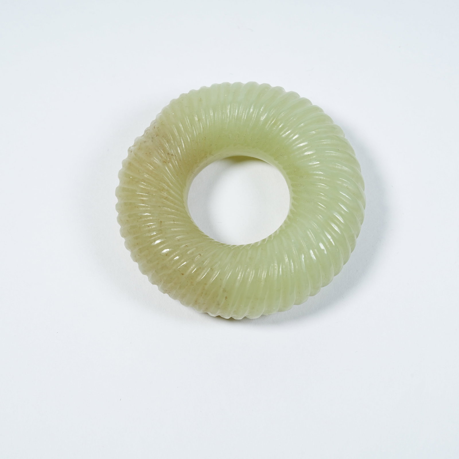 A ANCIENT JADE TWISTED SILK RING: Ancient Jade Twisted Silk Ring