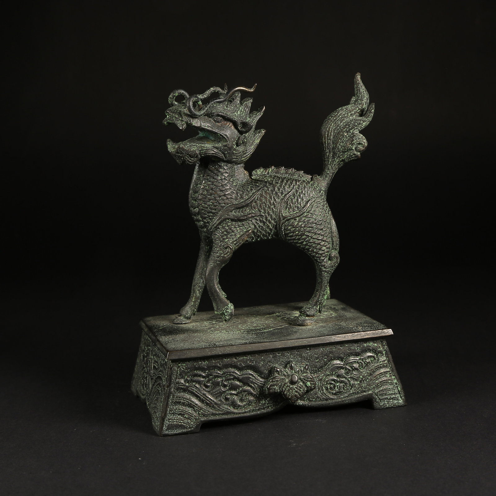 A BRONZE QILIN FIGURINE: Bronze Qilin Figurine