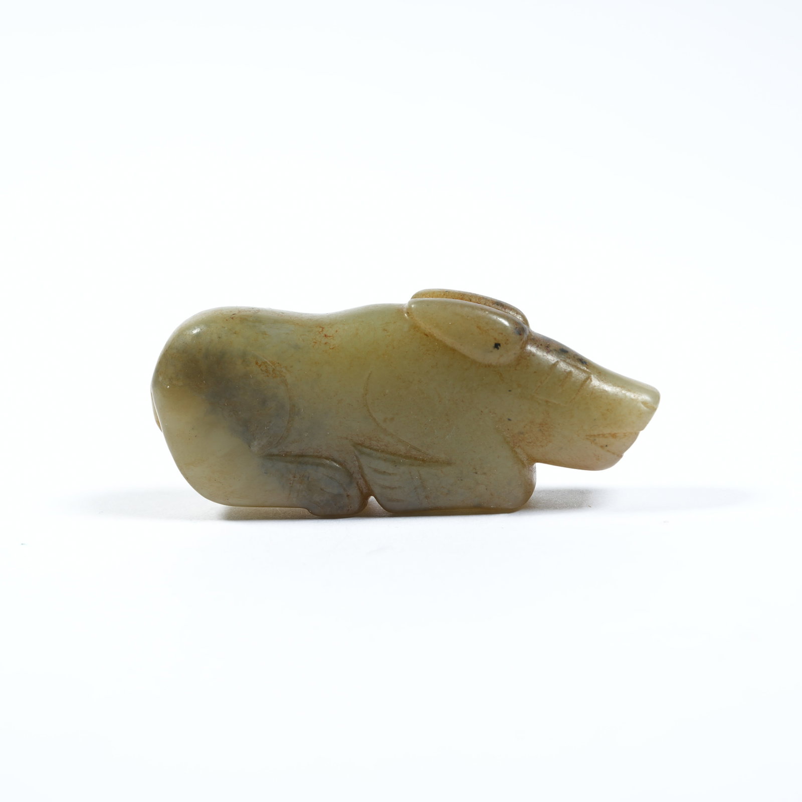 A ANCIENT JADE RECUMBENT BEAST PENDANT: Ancient Jade Recumbent Beast Pendant