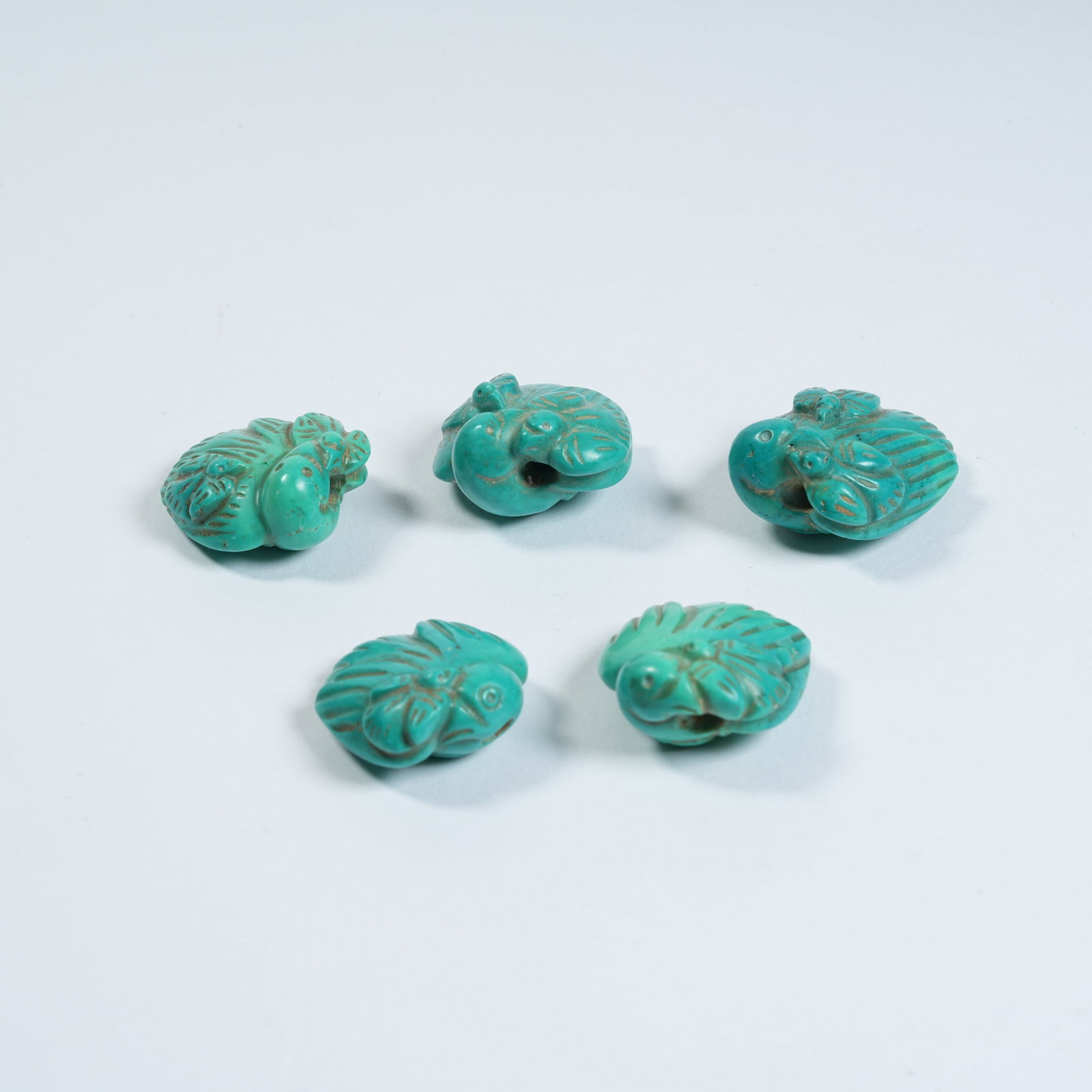 A SET OF TURQUOISE SWALLOW ORNAMENTS: Set of Turquoise Swallow Ornaments