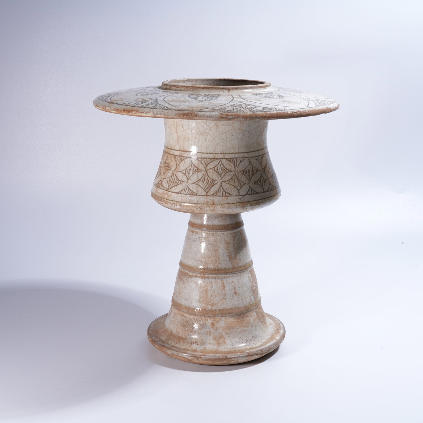 A CIZHOU KILN WHITE-GLAZED INCISED HAND WARMER (1 of 10)