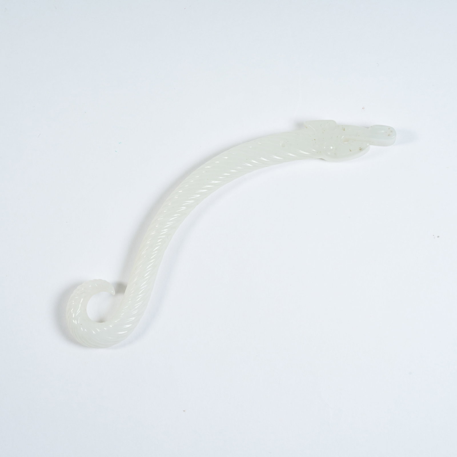 A WHITE HETIAN JADE DRAGON HOOK: White Hetian Jade Dragon Hook