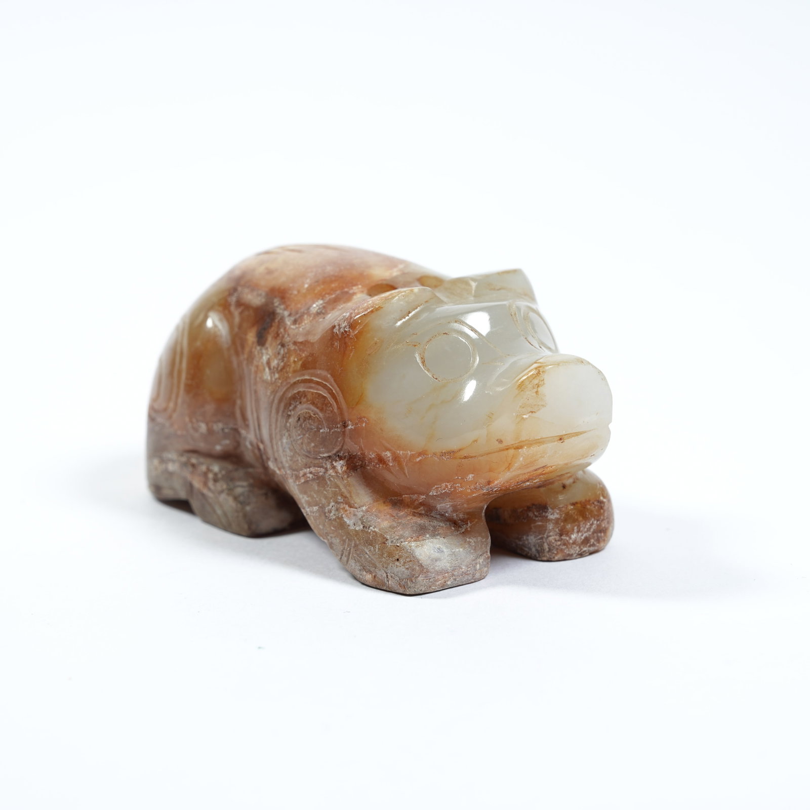 A ANCIENT JADE RECUMBENT BEAST PENDANT: Ancient Jade Recumbent Beast Pendant