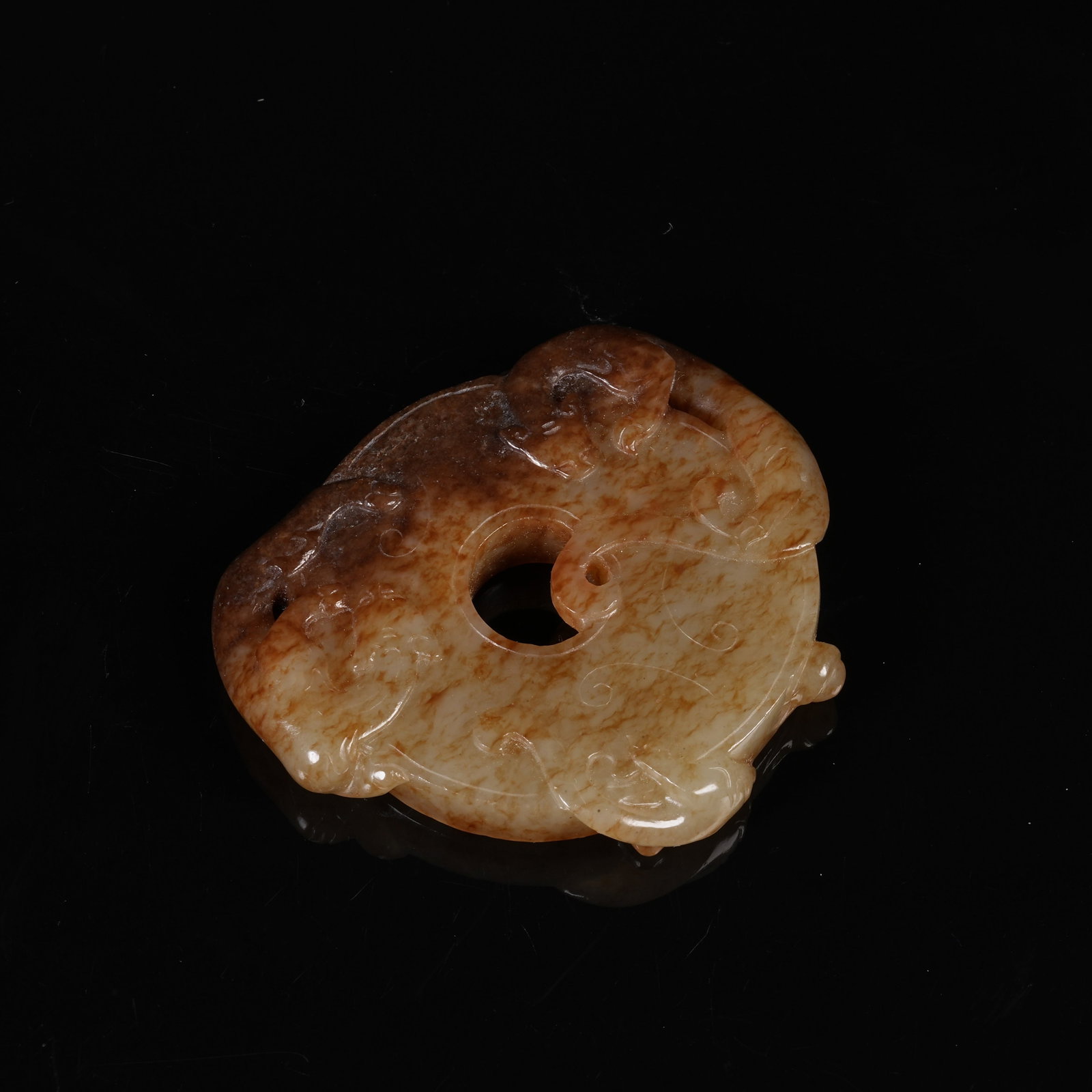 A ARCHAIC JADE BI DISC WITH OUTER CHILONG PATTERNS: Archaic Jade Bi Disc with Outer Chilong Patterns
