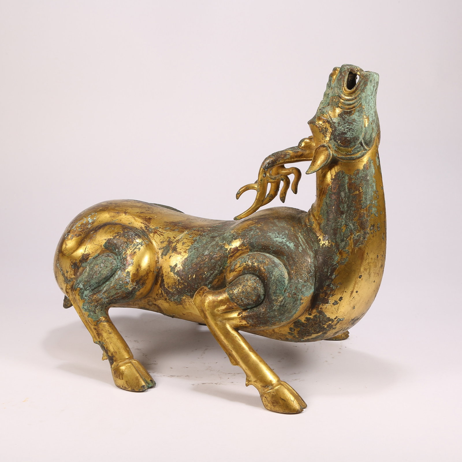 A BRONZE AUSPICIOUS-BEAST FIGURINE: Bronze auspicious-beast figurine