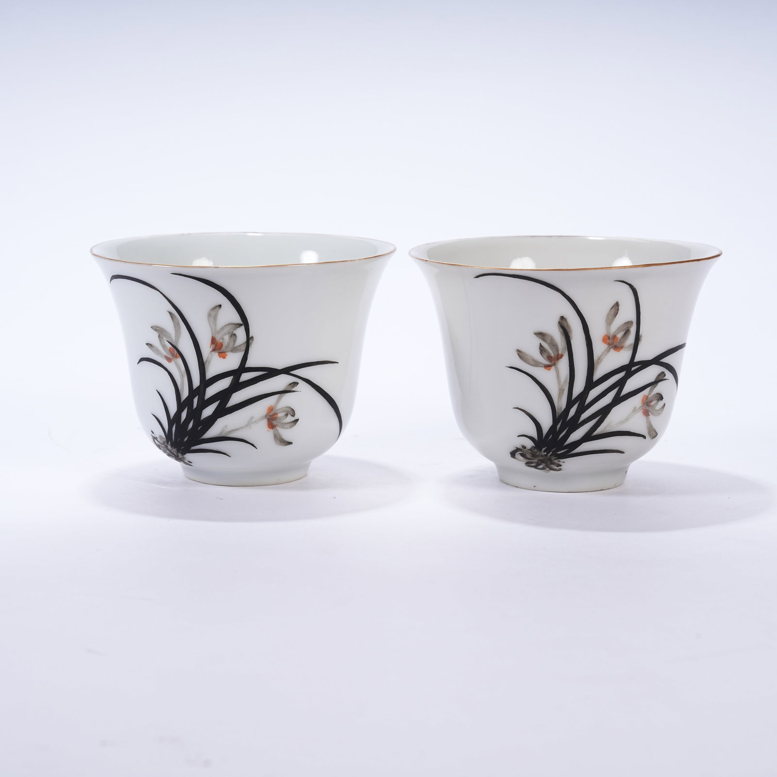 A SET OF INK COLOR CUPS WITH FLORAL PATTERNS: Set of Ink Color Cups with Floral Patterns