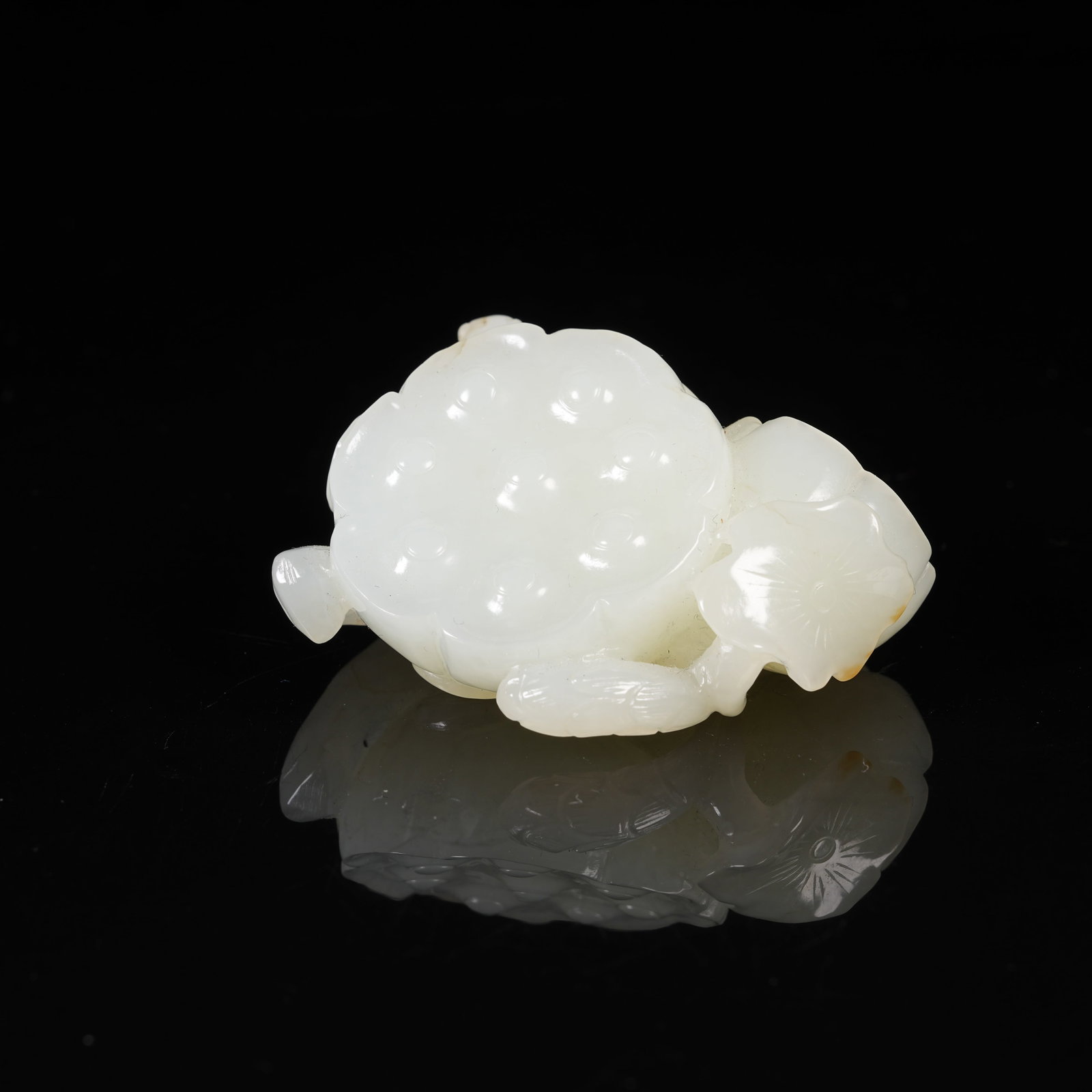 A WHITE HETIAN JADE LOTUS SEED POD PENDANT: White Hetian Jade Lotus Seed Pod Pendant