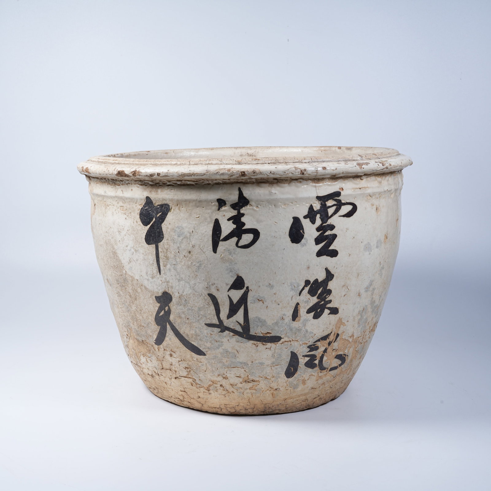 A CIZHOU KILN FLOWER POT CARVED WITH CHARACTERS: Cizhou Kiln Flower Pot Carved with Characters