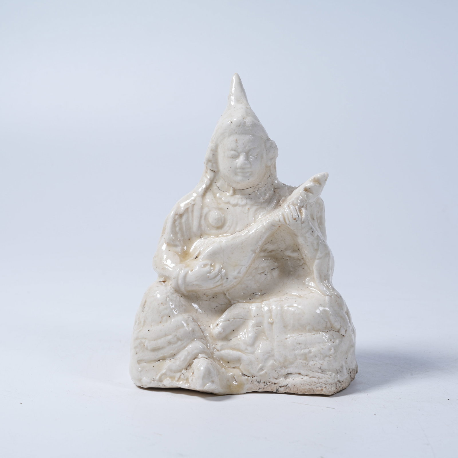 A DING KILN HEAVENLY KING ORNAMENT (1 of 9)