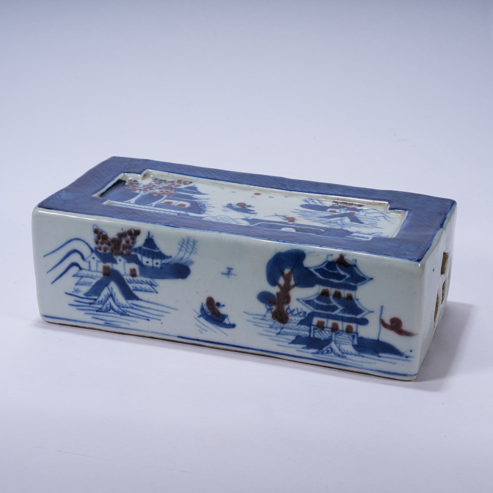 A BLUE AND WHITE UNDERGLAZE RED PILLOW WITH LANDSCAPE AND FIGURAL PATTERNS (1 of 9)
