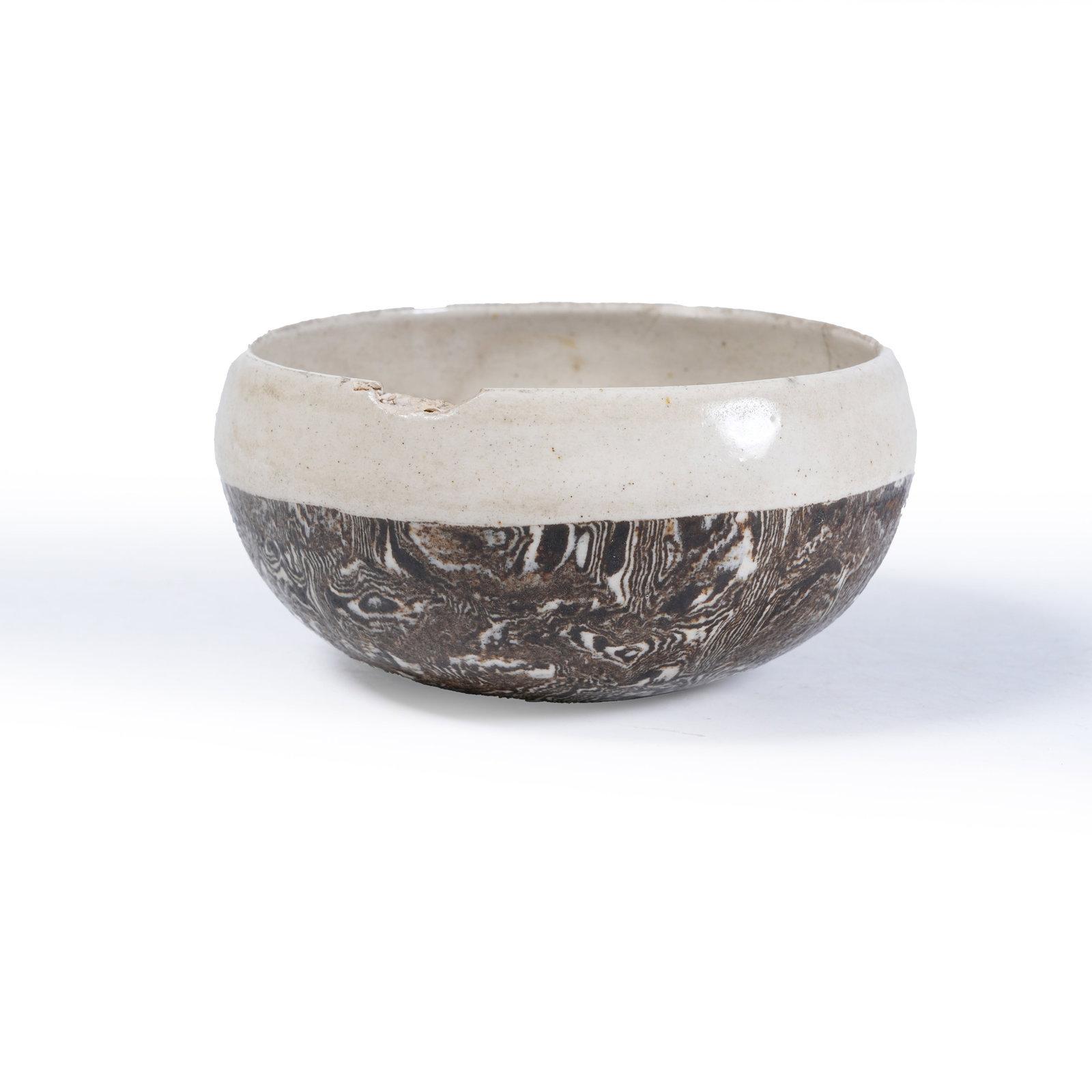A MARBLED CLAY BOWL-SHAPED WASHER: Marbled Clay Bowl-Shaped Washer