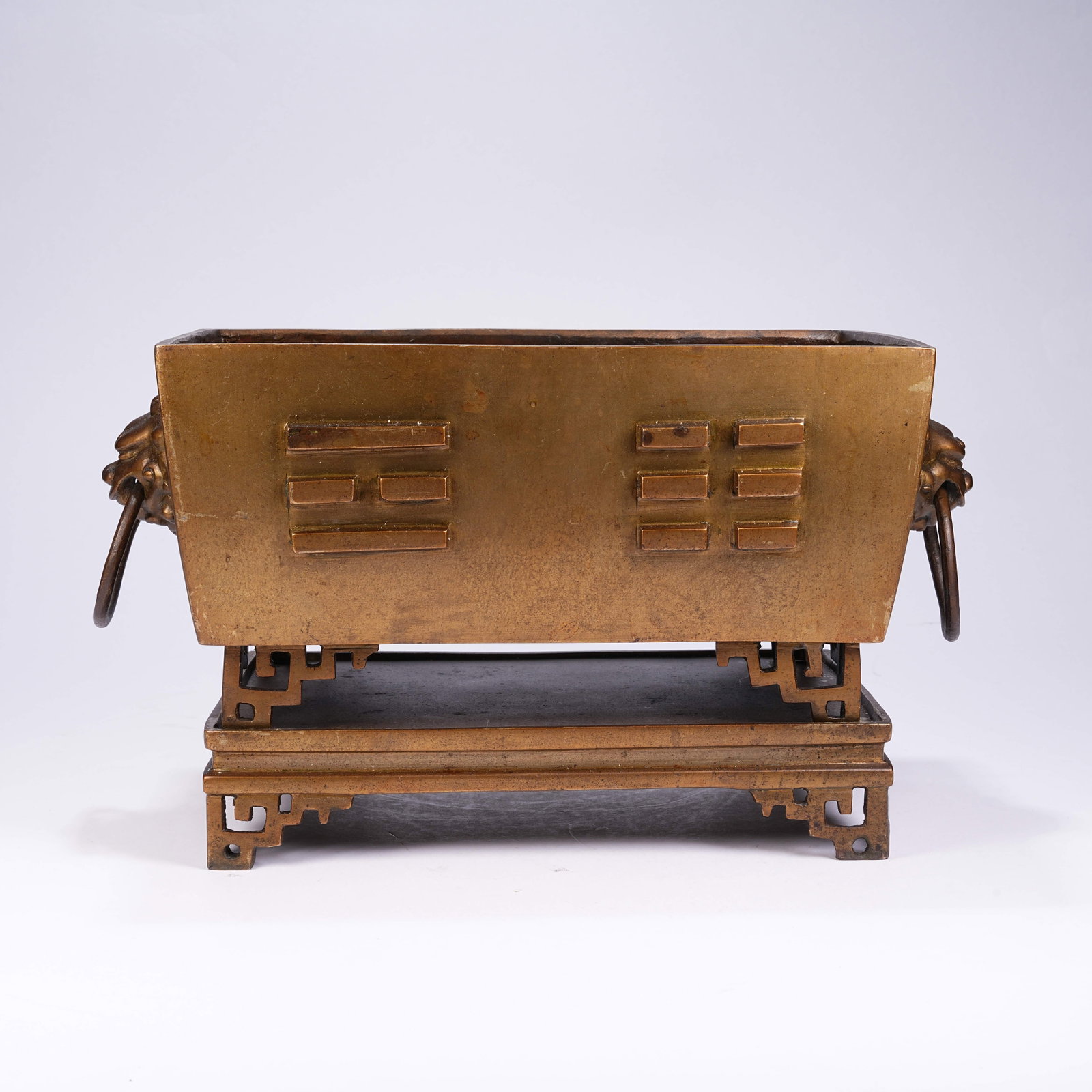 A BRONZE CENSER WITH EIGHT TRIGRAMS PATTERNS AND BEAST HEAD HANDLES: Bronze Censer with Eight Trigrams Patterns and Beast Head Handles