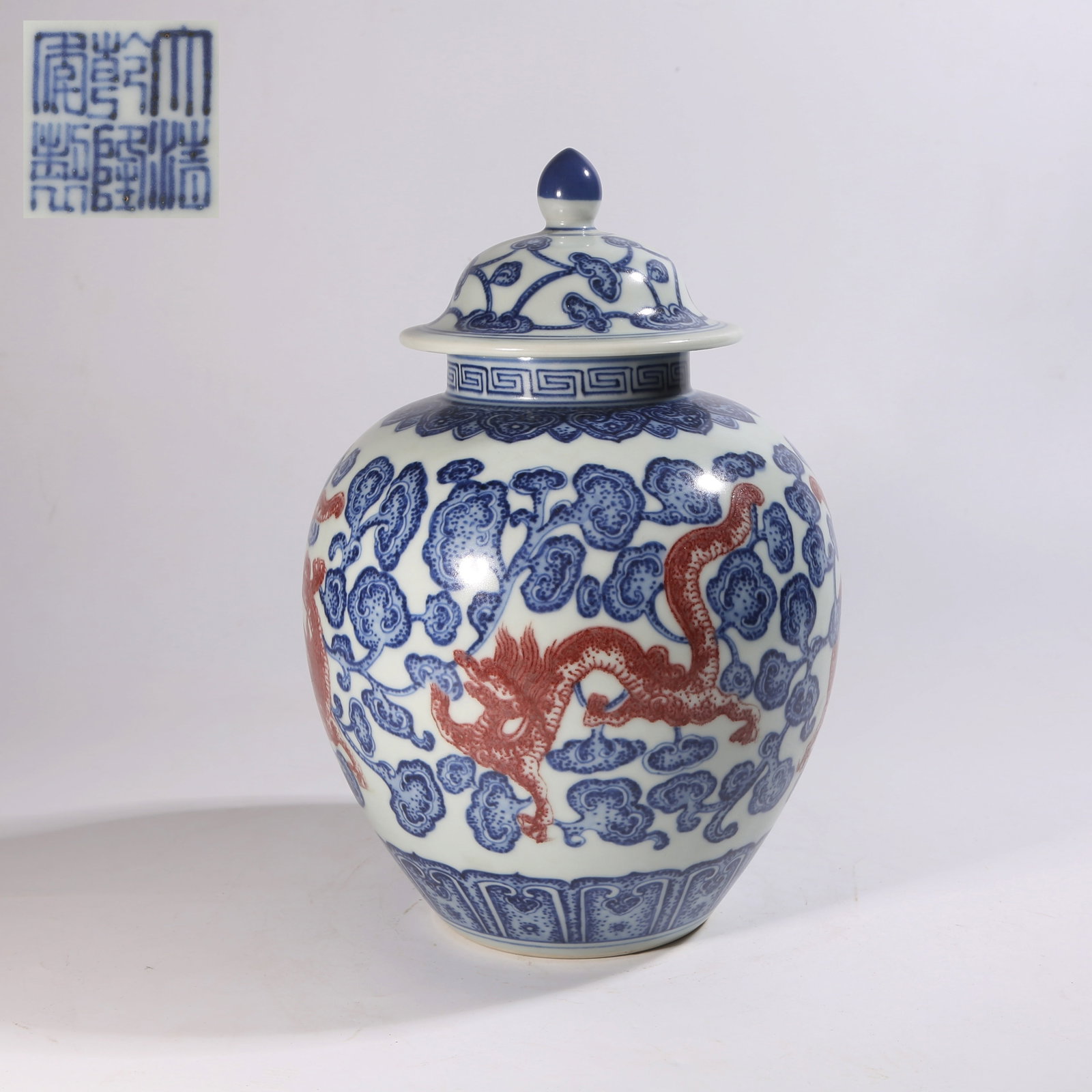 A BLUE-AND-WHITE UNDERGLAZE-RED COVERED JAR WITH LINGZHI AND DRAGON DESIGN (1 of 10)