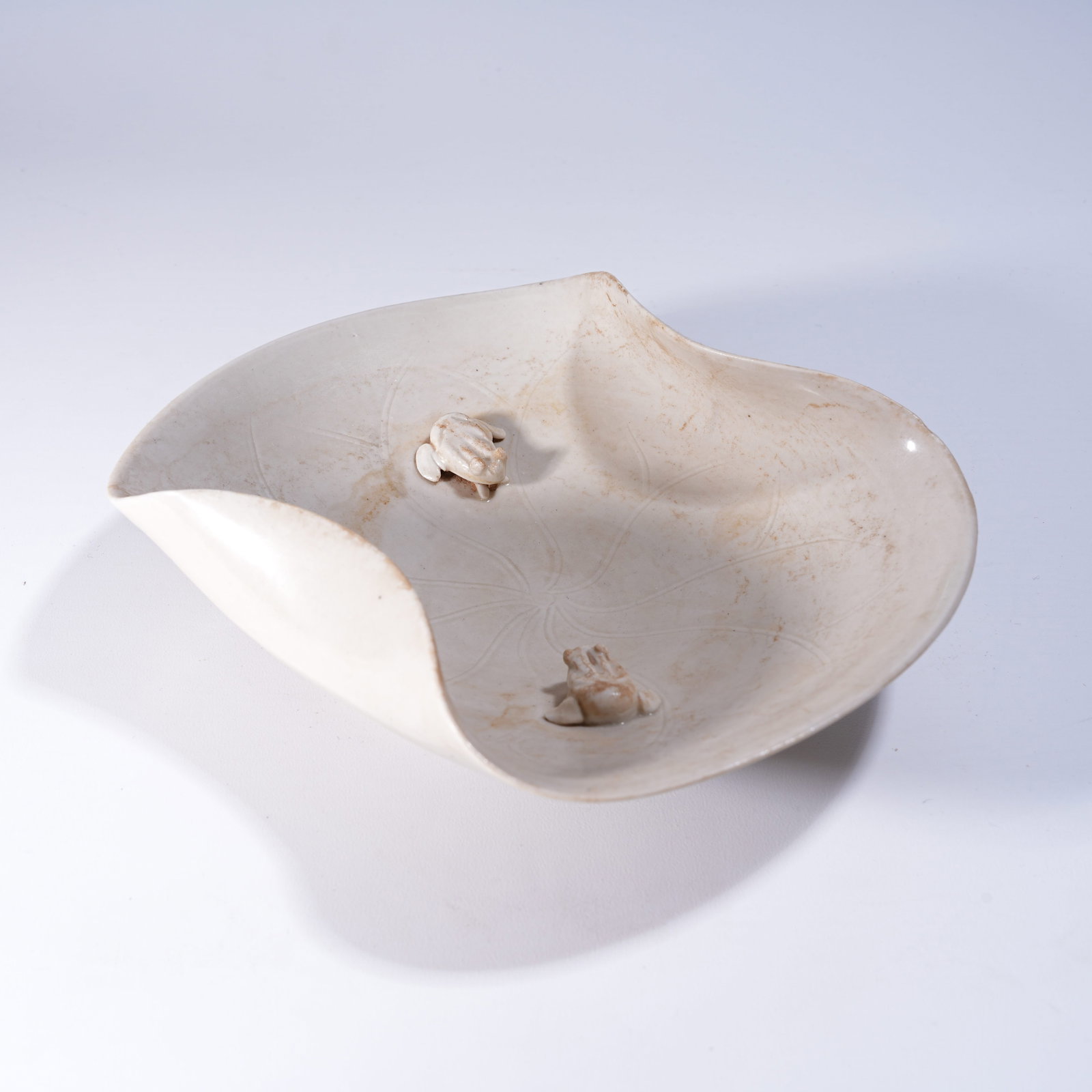 A DING KILN CARVED PORCELAIN WASHER WITH "FROGS BRINGING WEALTH" MOTIF (1 of 8)