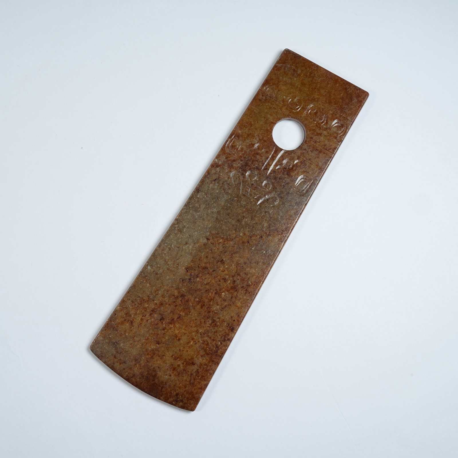 A ANCIENT JADE SHOVEL WITH BEAST MASK PATTERNS: Ancient Jade Shovel with Beast Mask Patterns
