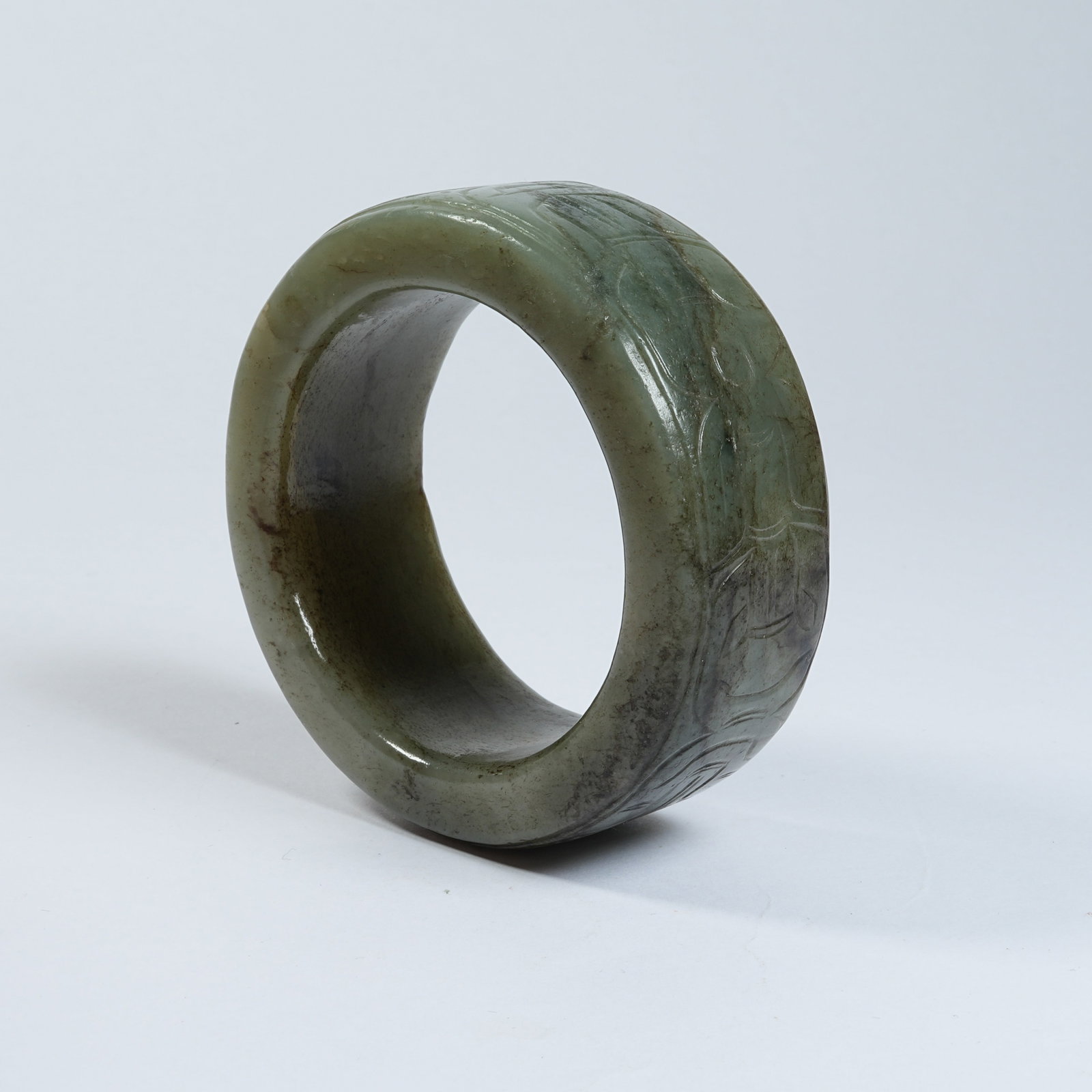 A ANCIENT JADE BRACELET WITH DEITY MASK PATTERNS: Ancient Jade Bracelet with Deity Mask Patterns