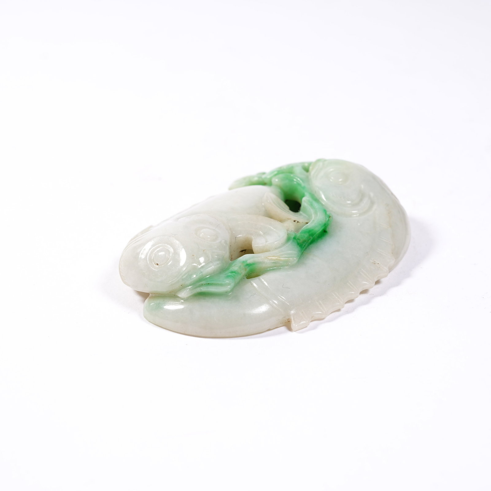 A JADEITE PENDANT WITH ABUNDANCE MOTIF: Jadeite Pendant with Abundance Motif
