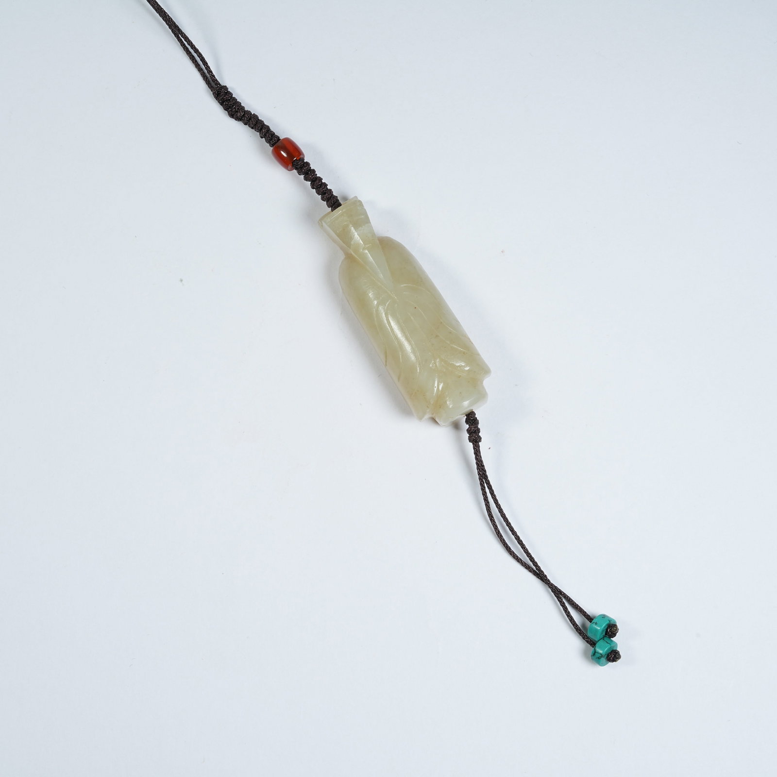 A ANCIENT JADE WENG ZHONG PENDANT: Ancient Jade Weng Zhong Pendant