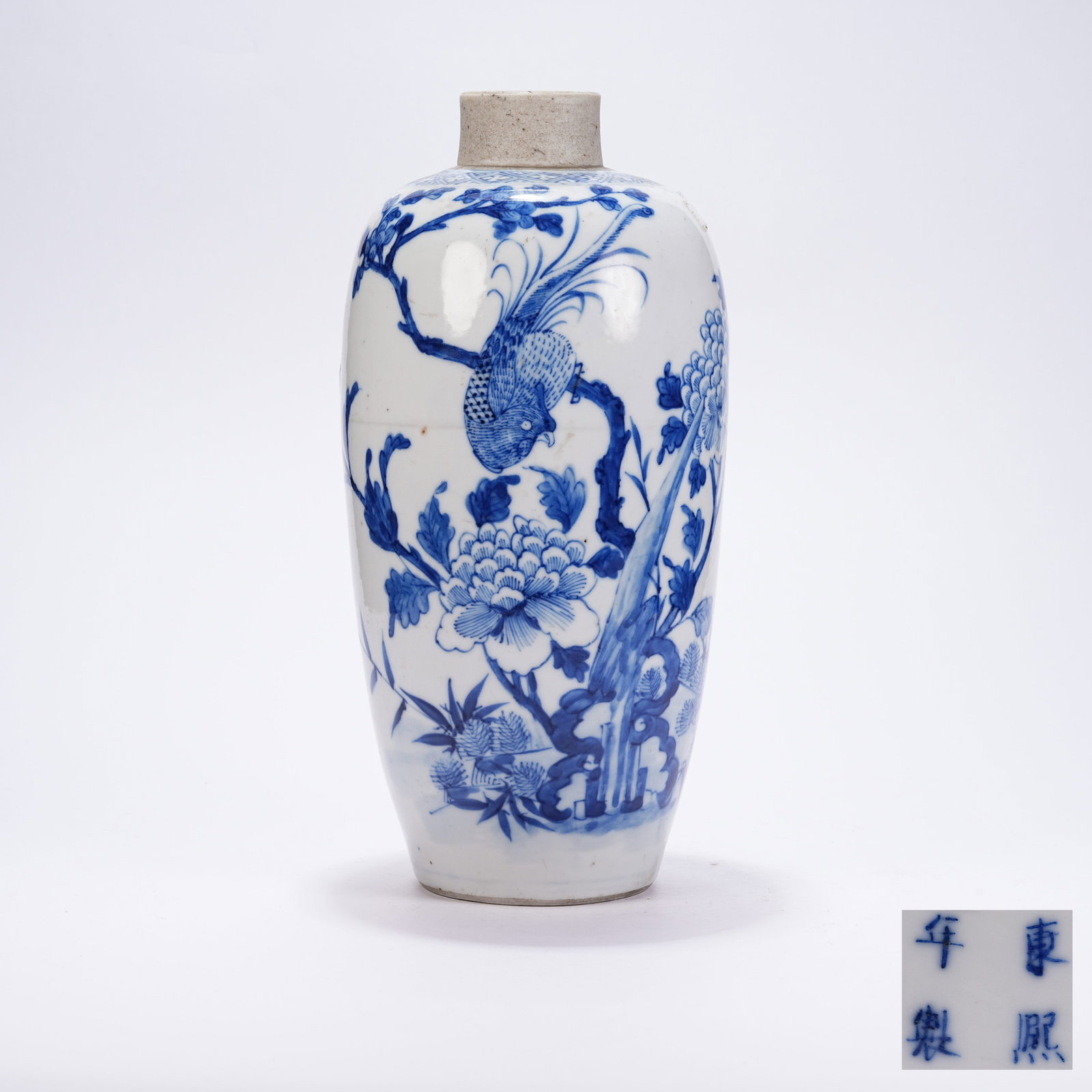 A BLUE AND WHITE VASE WITH FLOWER AND BIRD PATTERNS: Blue and White Vase with Flower and Bird Patterns