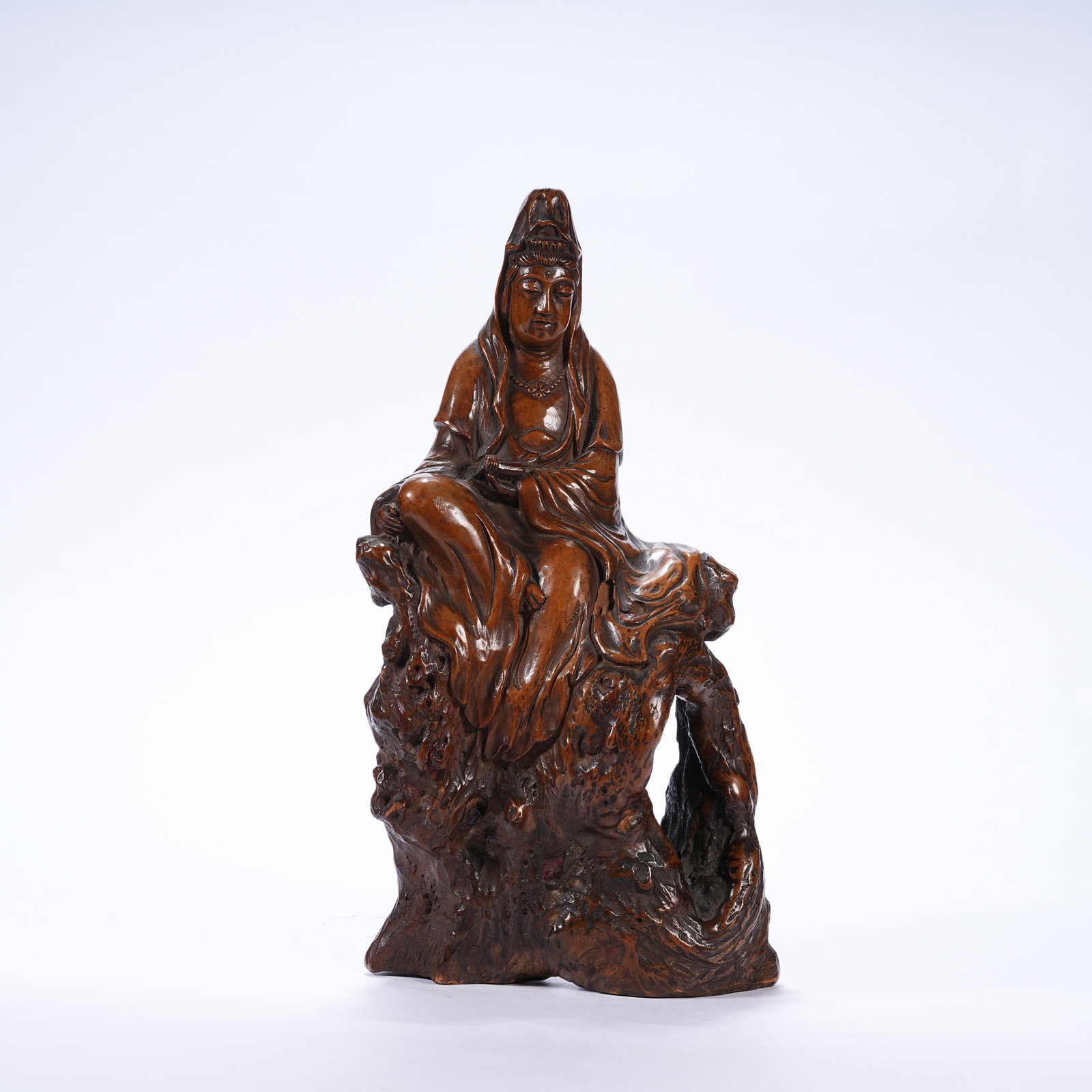 A HUANGHUALI WOOD GUANYIN STATUE HOLDING SCROLL: Huanghuali Wood Guanyin Statue Holding Scroll