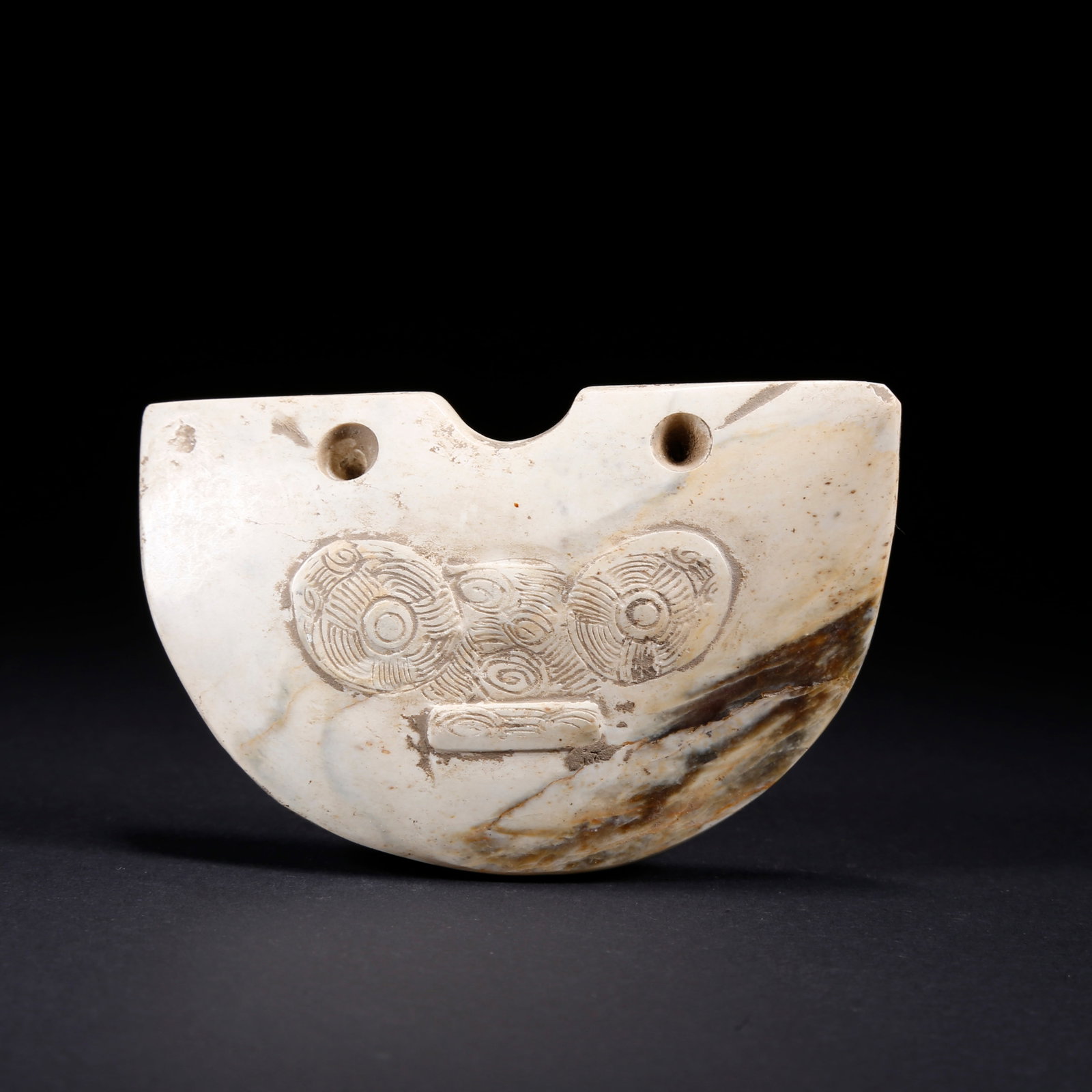 A TAOTIE PATTERN CARVED ANCIENT JADE PENDANT: Taotie Pattern Carved Ancient Jade Pendant