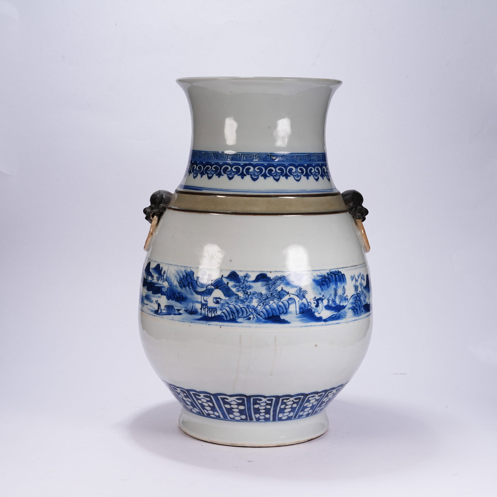 A BLUE AND WHITE ZUN VASE WITH LANDSCAPE, FIGURES AND BEAST HEAD HANDLES (1 of 9)
