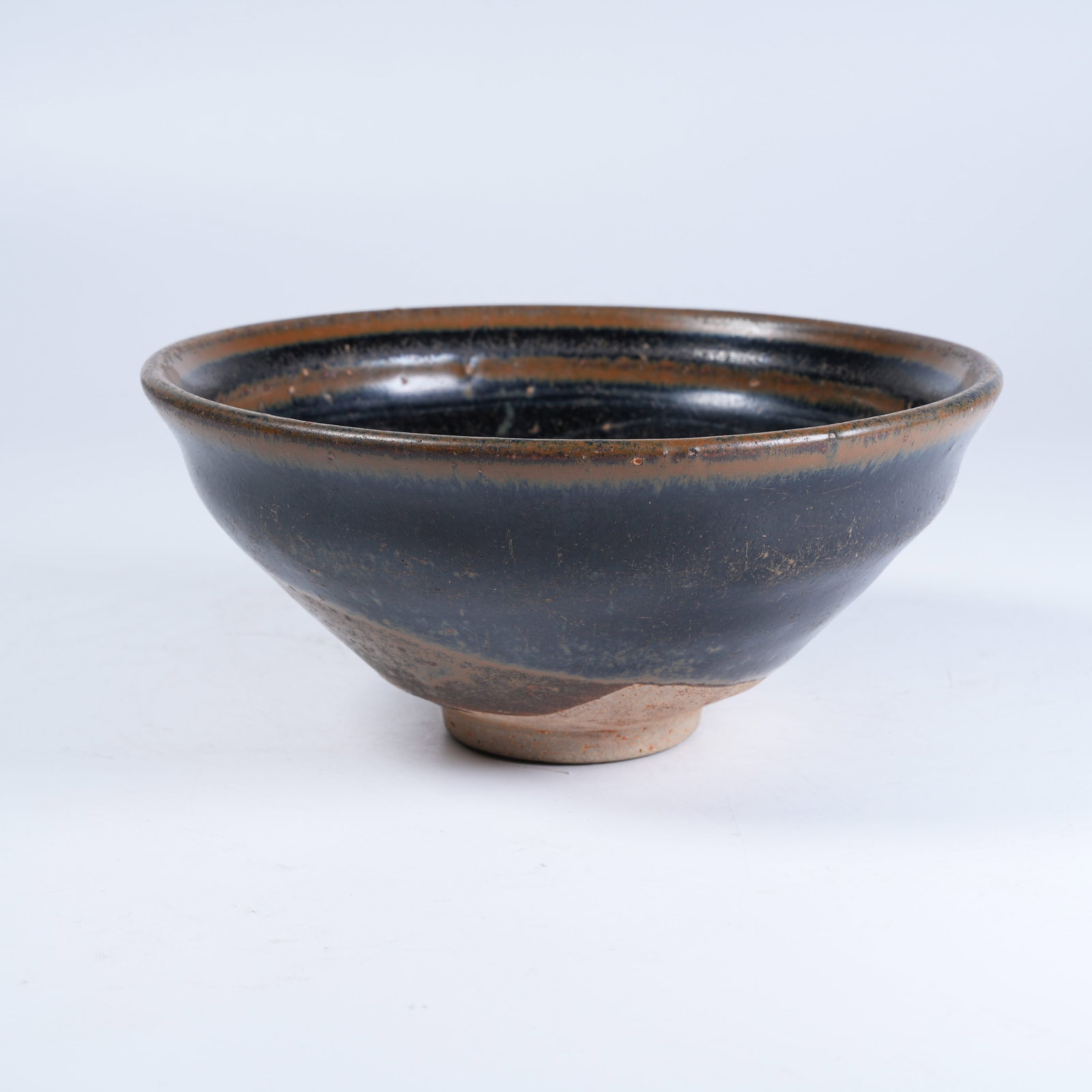 A CIZHOU KILN TEA BOWL SUBTLY INCISED WITH LOTUS PATTERNS: Cizhou Kiln Tea Bowl Subtly Incised with Lotus Patterns