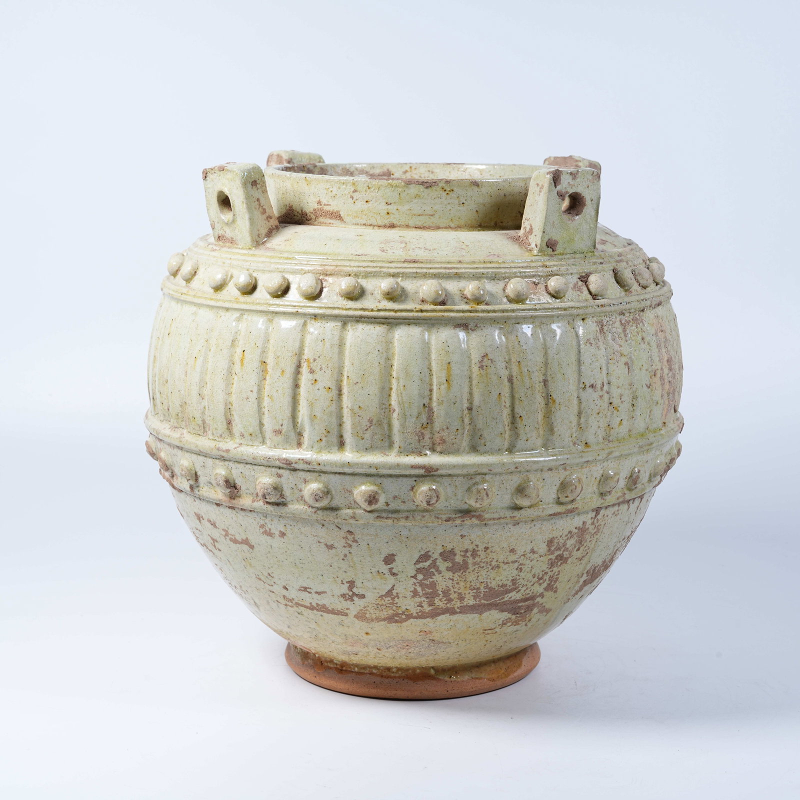 A PRIMITIVE SANCAI FOUR-LUG JAR WITH NAIL STUD DECORATIONS (1 of 9)