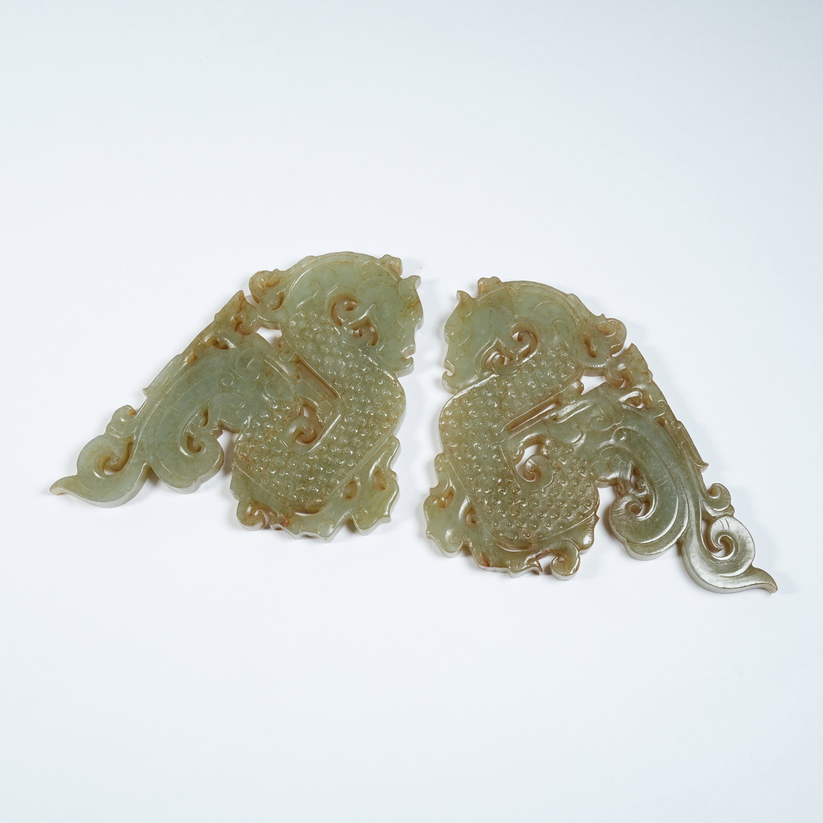 A SET OF ANCIENT JADE S-SHAPED DRAGON PENDANTS (1 of 10)