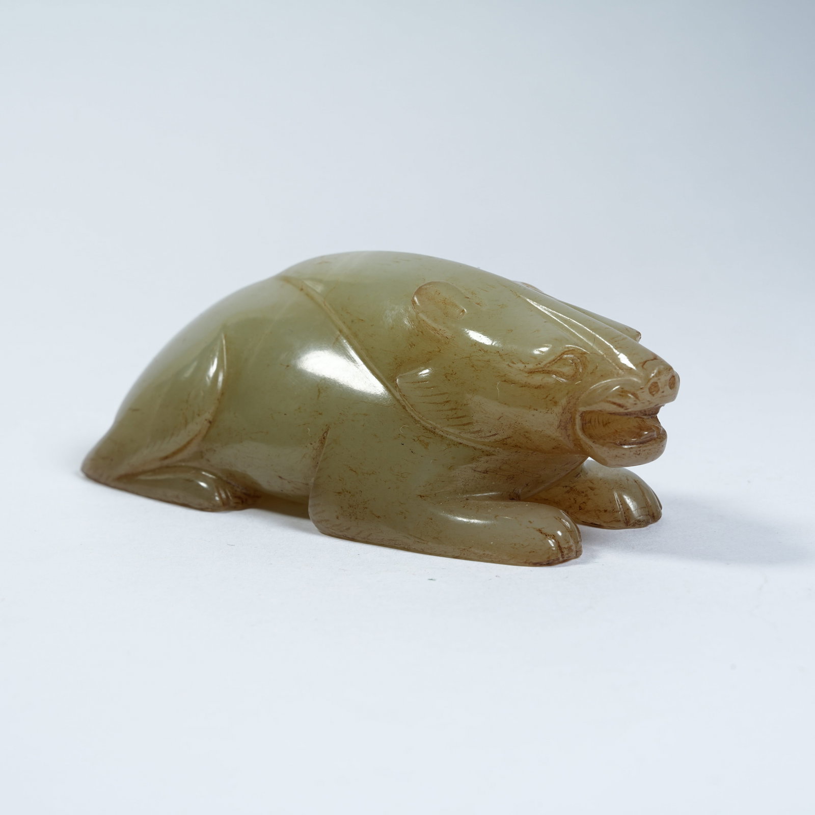 A ANCIENT JADE RECUMBENT BEAR ORNAMENT (1 of 8)