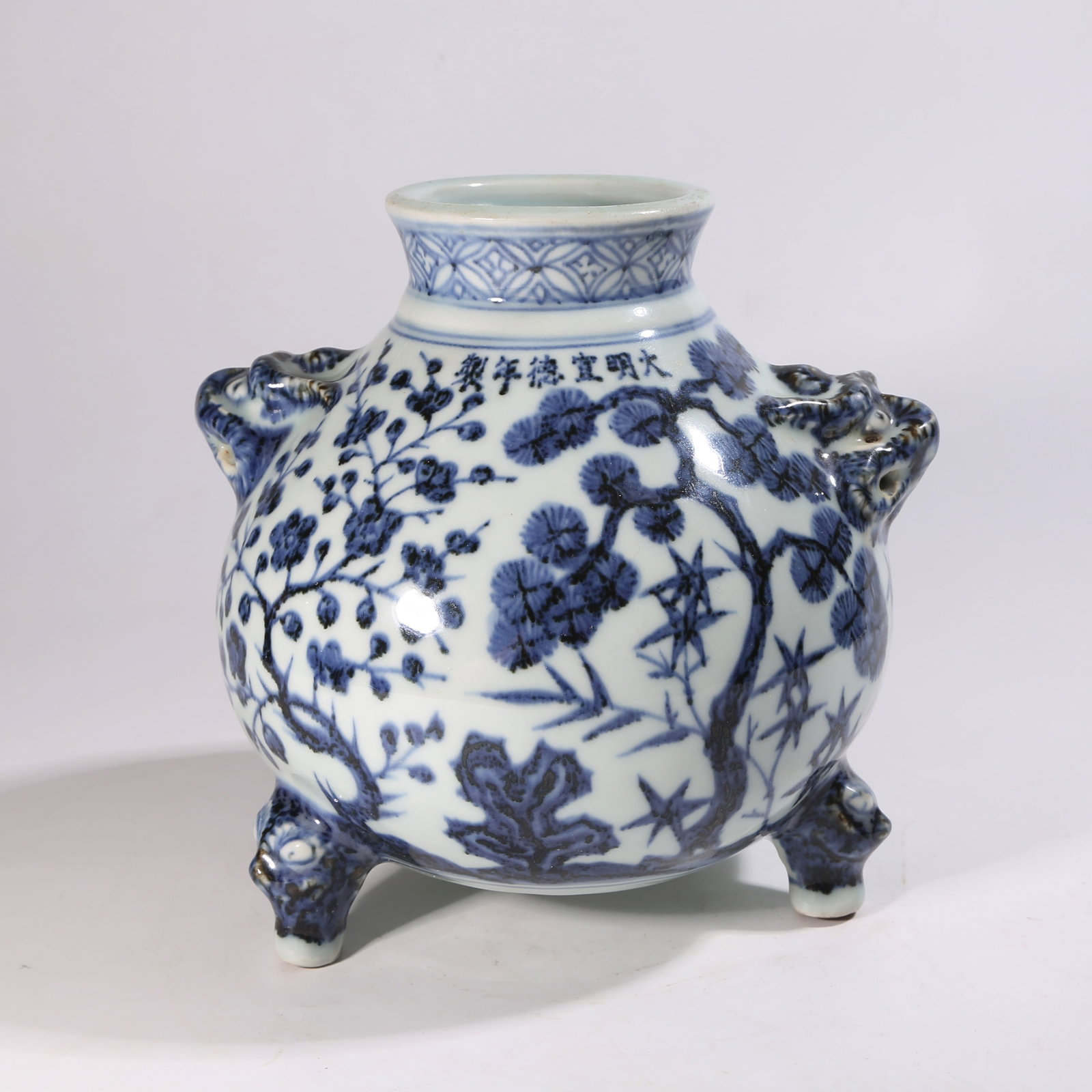 A BLUE-AND-WHITE THREE-LEGGED CENSER WITH "THREE FRIENDS OF WINTER" MOTIF AND BEAST HANDLES (1 of 9)