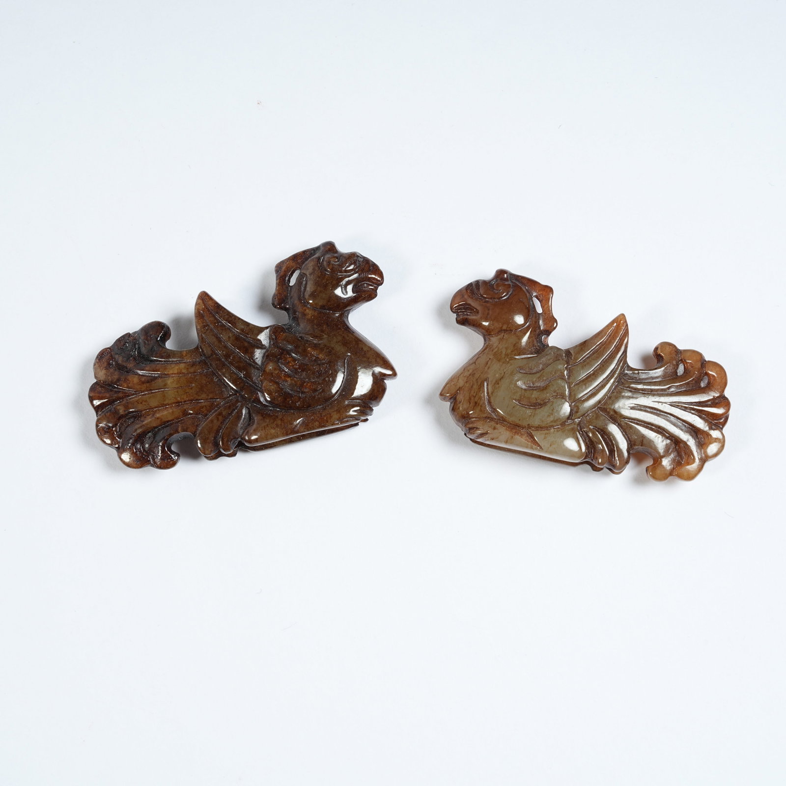 A SET OF ANCIENT JADE PHOENIX PENDANTS: Set of Ancient Jade Phoenix Pendants